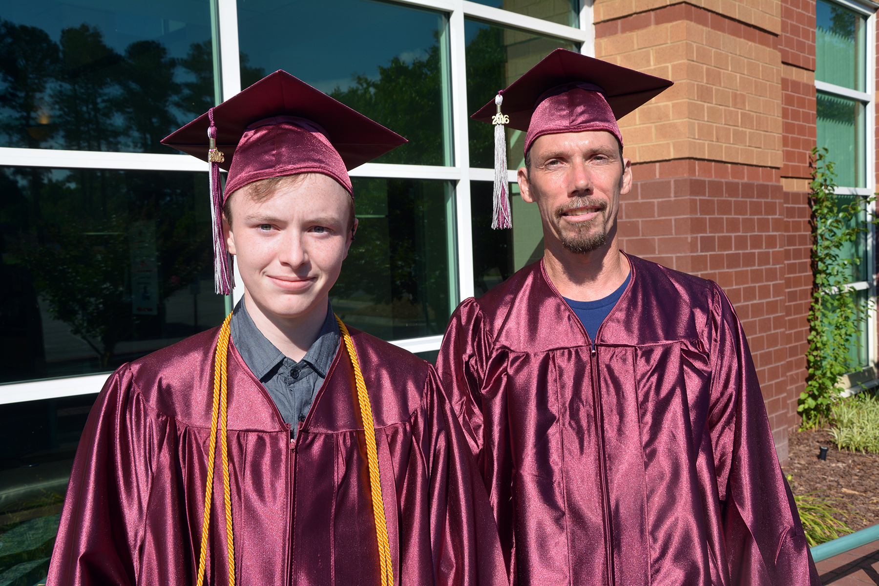 Pictured are Caleb Adcock, left, and Arnold Bennett, who were guest speakers at the Adult High School and High School Equivalency graduation at Richmond Community College.