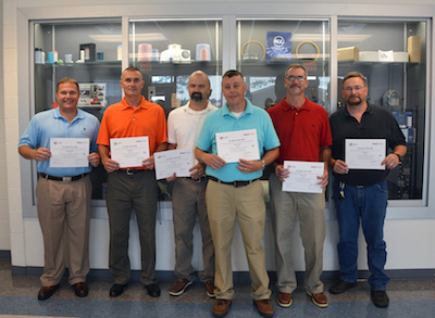 Receiving certificates for completing a customized training program to improve productivity were, from left to right, Doug McFayden, Allen Martin, Mark Pearson, Marcus Bryant, Glenn Lovin and Jay Ingram. Richmond Community College coordinated the training program for NOVIPAX and Big Rock Sports.