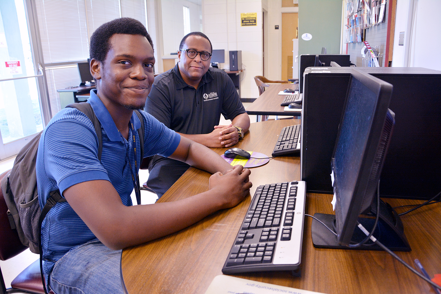 Counselor Chris Gardner works with a student in Student Services