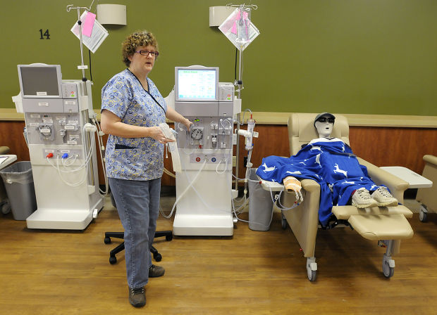 An instructor explains how the dialysis machine operates