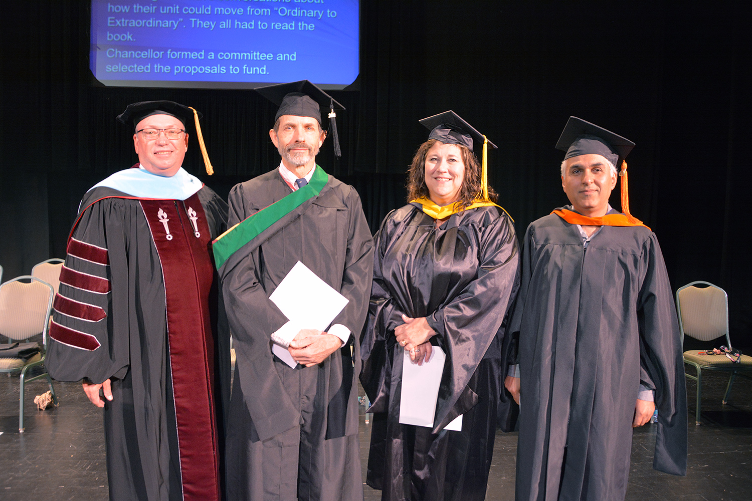 President McInnis stands with Faculty of the Year candidates. Winner Lara Nosser is not pictured.