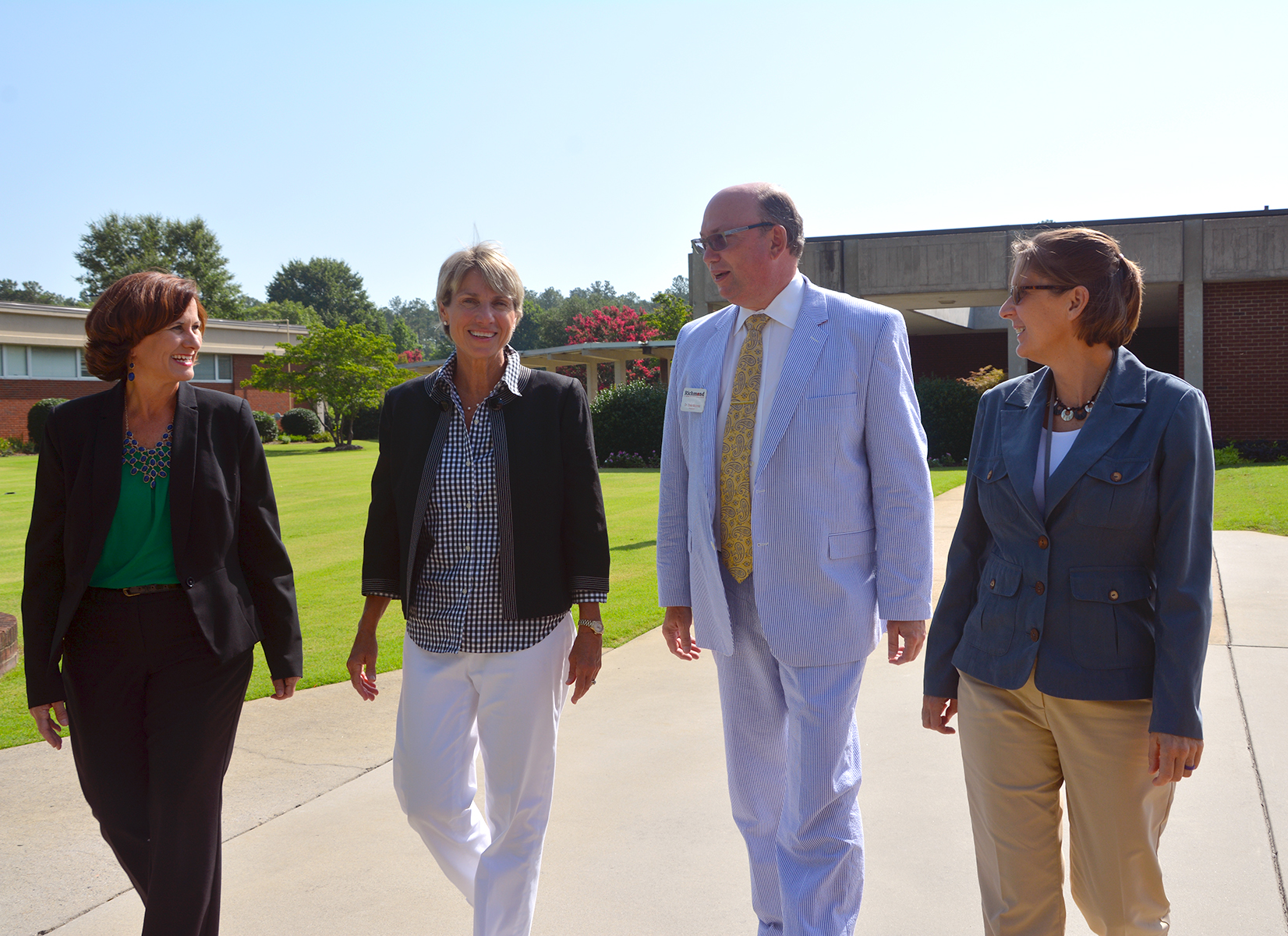 Pictured walking across campus at Richmond Community College are, from left to right, Kelly DeLong, director of K-12 Math and Science; Dr. Cindy Goodman, superintendent for Richmond County Schools; Dr. Dale McInnis, RCC president; and Cynthia Reeves, RCC’s associate dean of Institutional Effectiveness and Improvement. RCC and Richmond County Schools recently received a $750,000 grant from the Golden LEAF Foundation.