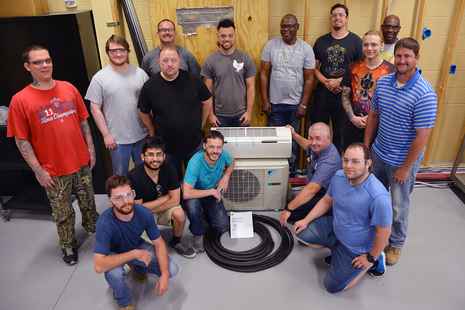 HVACR students stand with the donated Daikin unit