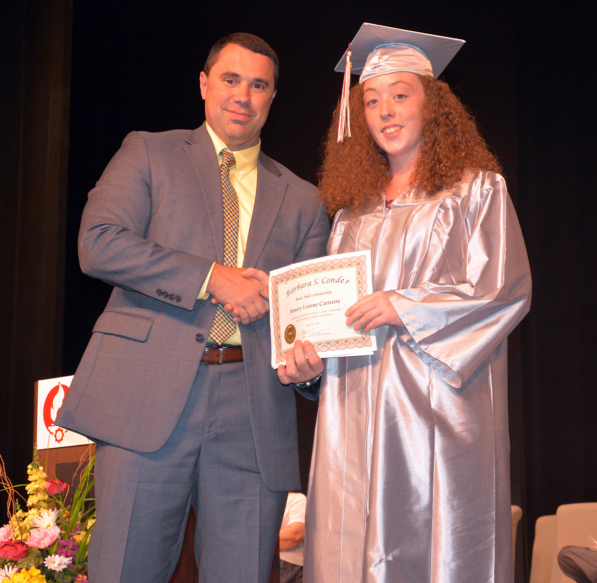 1 Jessery Cartrelle.jpg:  Pictured is Adult High School graduate Jessery Cartrelle receiving the Barbara S. Conder Basic Skills Scholarship. Presenting the scholarship is Dr. Robbie Taylor, vice president of the Workforce and Economic Development division at Richmond Community College