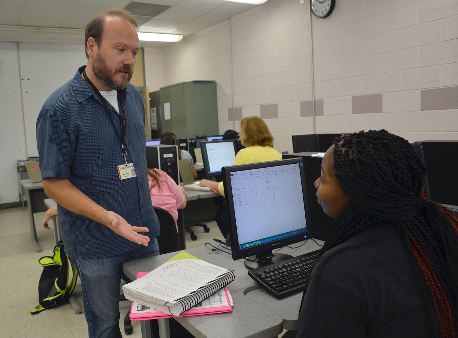 Information Technology lead instructor Lance Barber talks to one of his students in a computer class at Richmond Community College. The Information Technology program is now accepting new students for fall semester