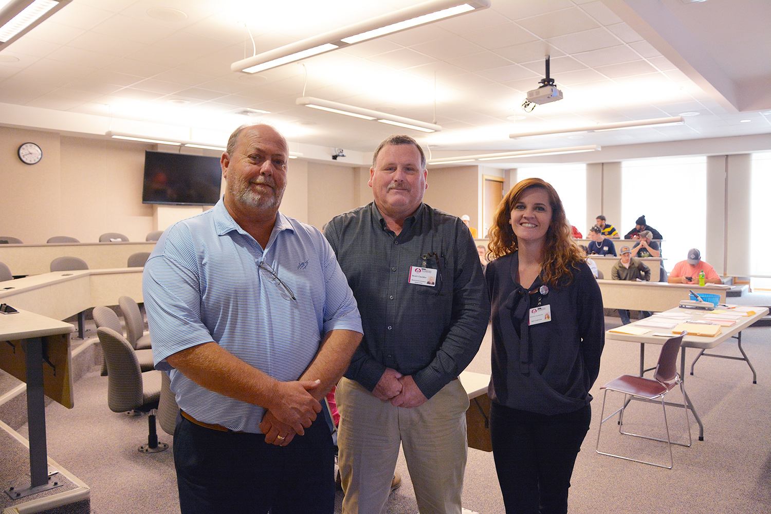 Mark Jones, Scott Caulder and Angineek Gillenwater pose for photo at Electric Lineman orientation