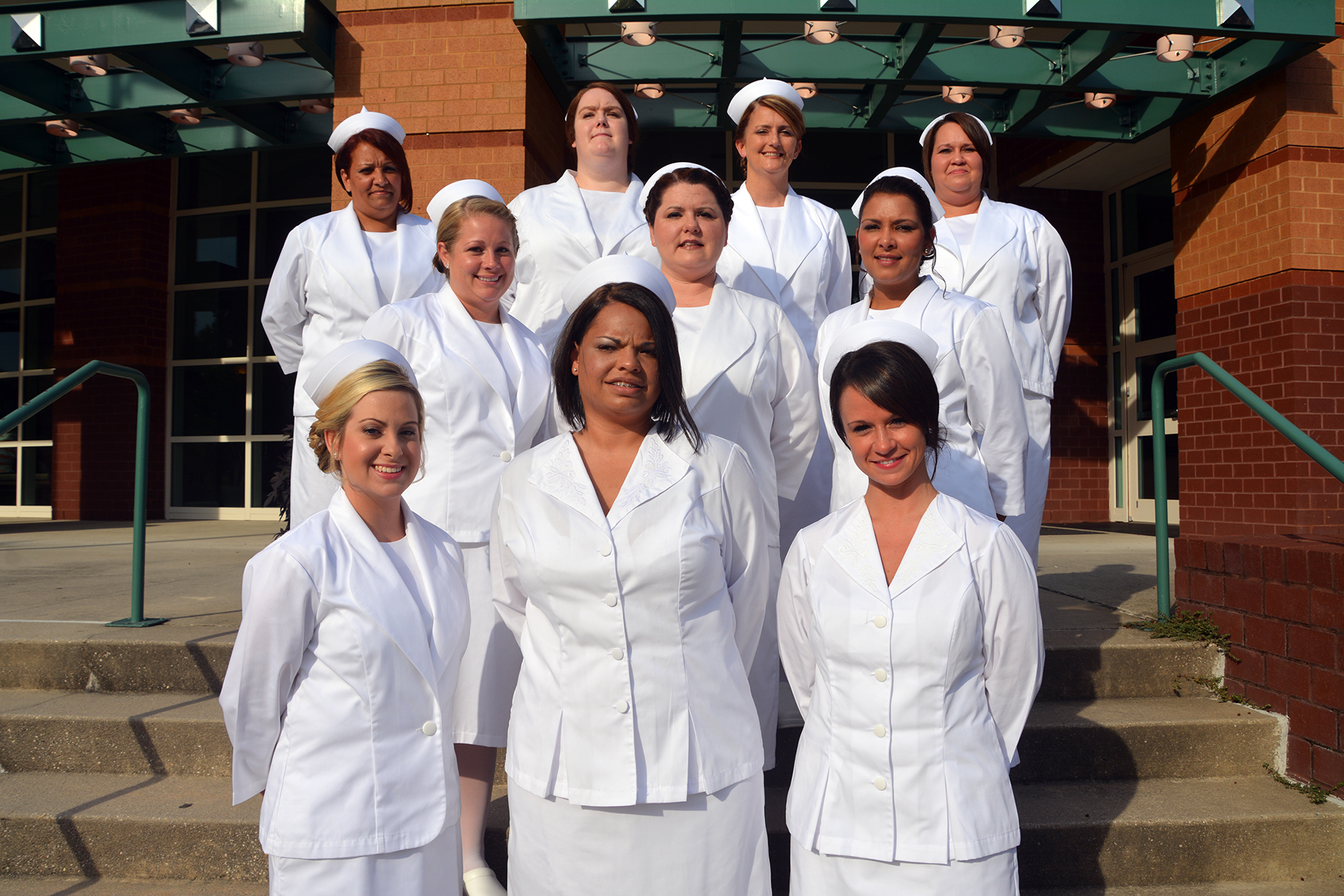 Practical Nursing graduates stand on the stairs of the Cole Auditorium.