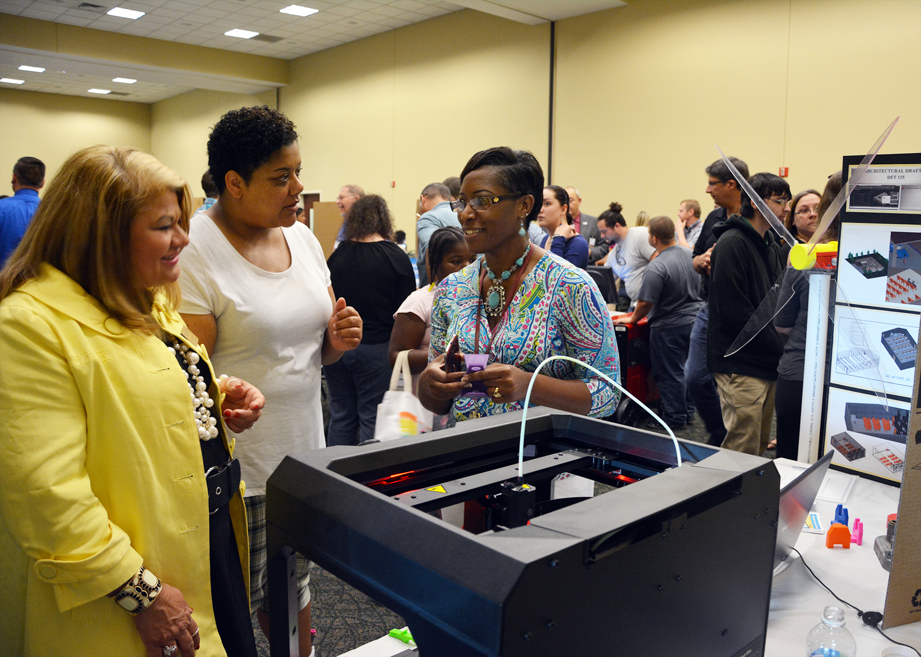 Mechanical Engineering lead instructor Annie Smith, right, explains how her students design parts and then print them on a 3D printer, which she had on display during last year’s RichmondCC Open House. This year’s Open House is scheduled for Thursday, April 27, from 5:30 to 7:30 p.m. at the Cole Auditorium.