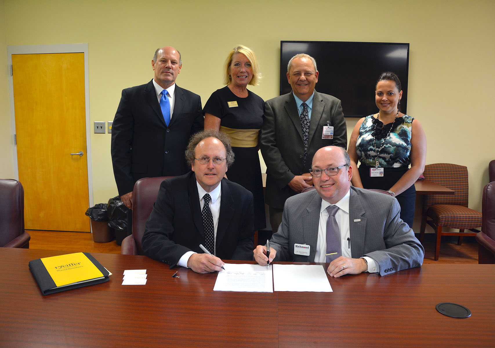Administrators from Pfeiffer University recently visited Richmond Community College to sign an articulation agreement that establishes several transfer tracks for RCC students. Pictured are seated, from left, Dr. Mark McCallum, associate vice president for Academic Affairs, associate provost and chair Department of Biology, and Dr. Dale McInnis, president of RCC; standing, from left, Jeff Mincey, Pfeiffer’s assistant director of Admissions for Marketing and Community Engagement; Dr. Paulita Brooker, dean of Continuing Education and Adult Studies at Pfeiffer; Kevin Parsons, RCC’s vice president for Instruction; and Patsy Stanley, RCC’s director of University Transfer Services.