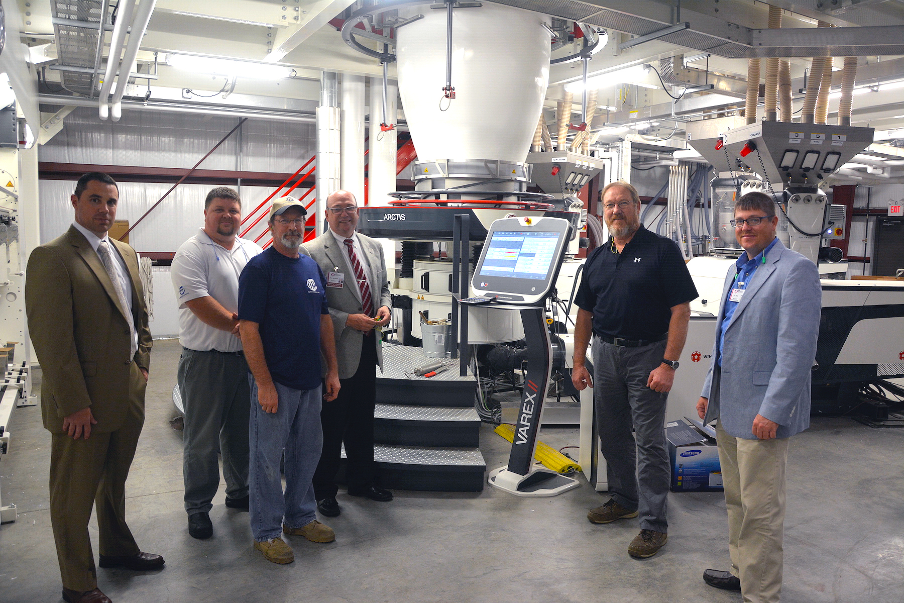 Richmond Community College recently partnered with Global Packaging to provide customized training for the company’s workforce. Pictured above, representatives from RichmondCC and Global Packaging stand with a piece of new equipment Global employees will be trained to use. Pictured, from left, are RichmondCC Director of Workforce and Economic Development Robbie Taylor, Global Packaging General Manager Kevin Stephens, Global Packaging Extruder Operator Ted Deese, RichmondCC President Dr. Dale McInnis, Global Packaging Plant Manager Paul Kinsey and RichmondCC Director of Customized Training Lee Eller.