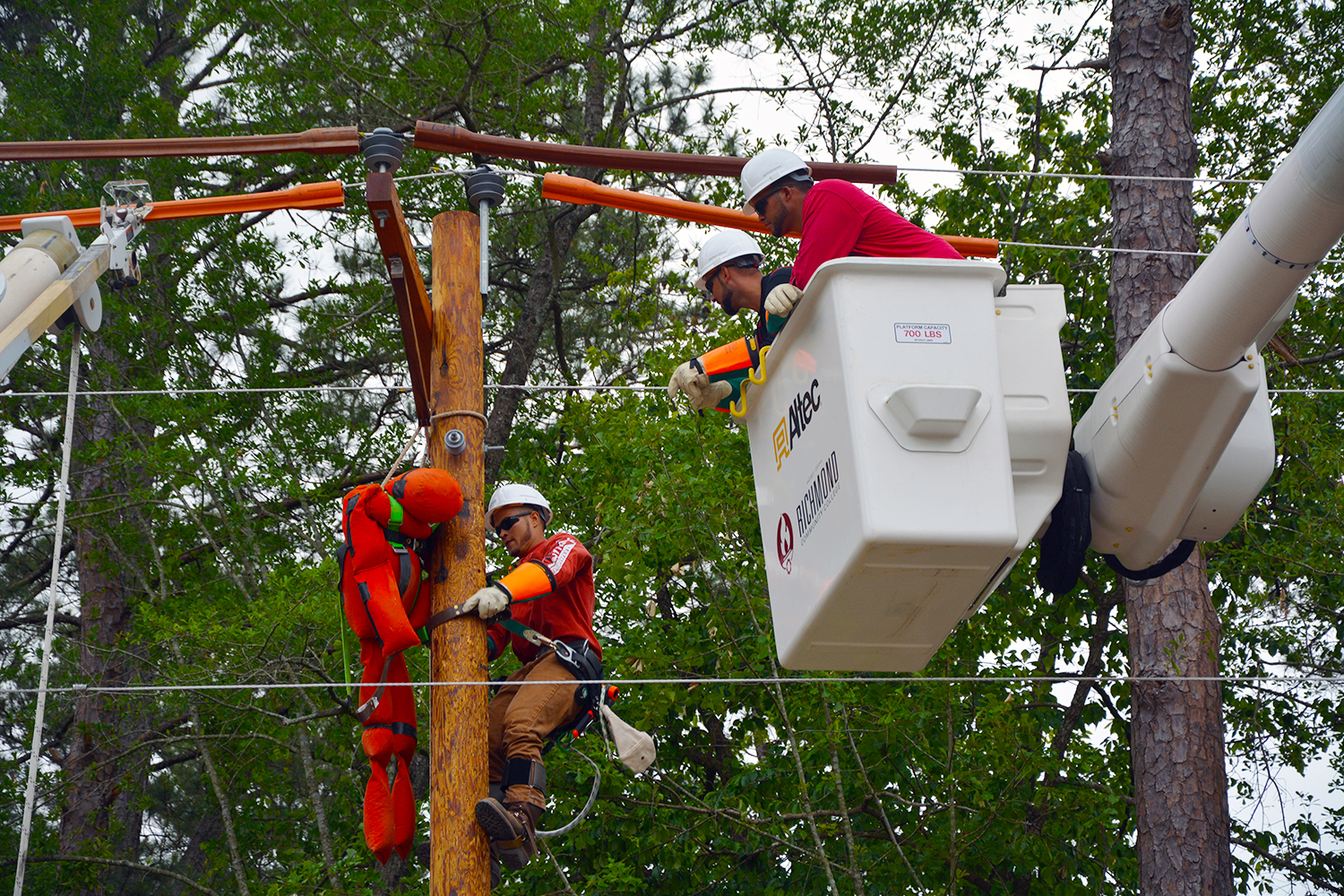 Electric Lineman students execute a pole top rescue