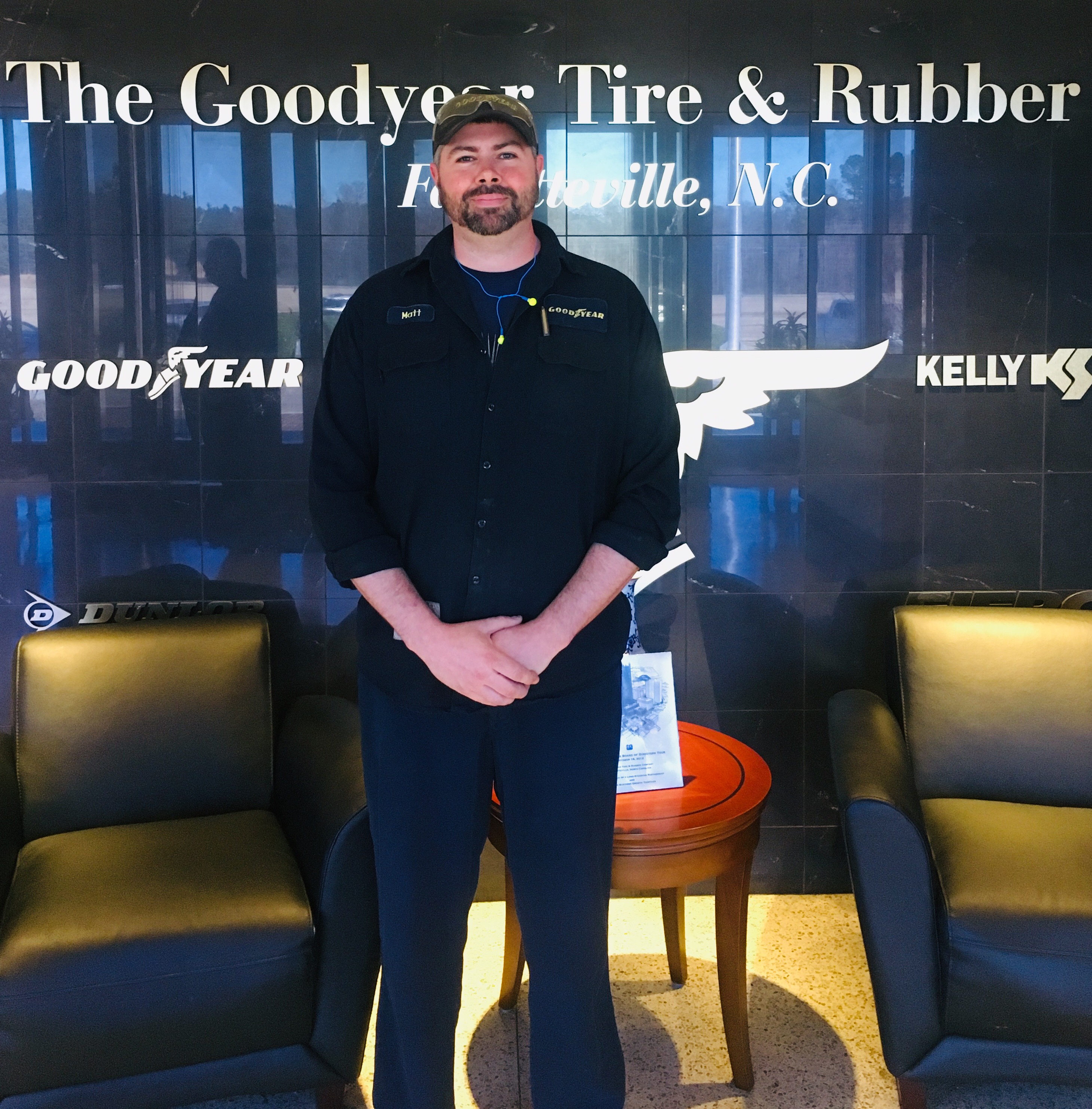 Matt Bower standing in front of a sign for Goodyear Tire & Rubber