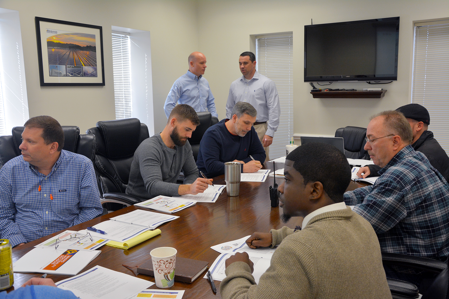 Pictured is a group of Service Thread employees in a training class offered in partnership with Richmond Community College. Standing in back are Service Thread Chief Operating Officer Jay Todd, left, and Vice President of Workforce & Economic Development for RichmondCC Robbie Taylor.