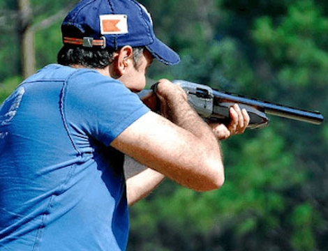 man shooting rifle