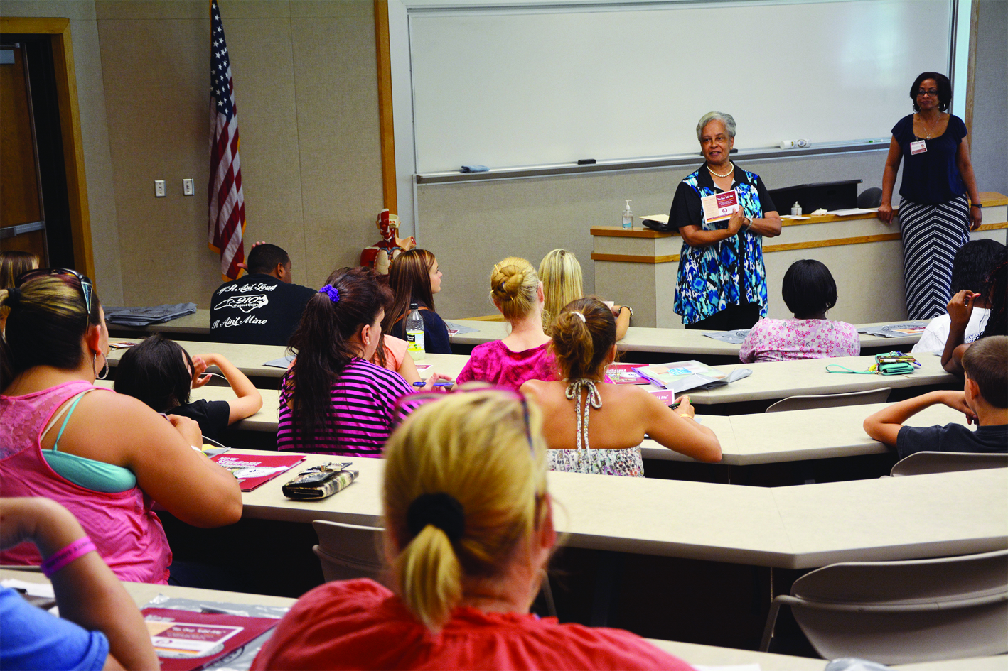Student Services staff members speak to students during an orientation session at Richmond Community College.