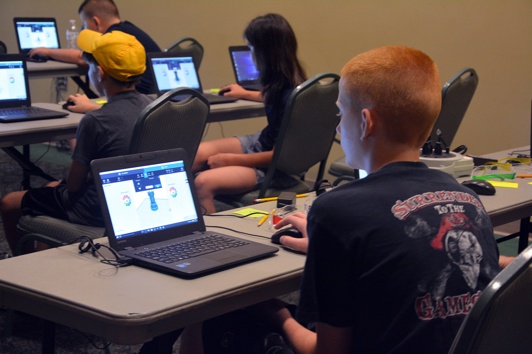 A student in the TechyKids summer camp looks at a 3D drawing on his computer. 
