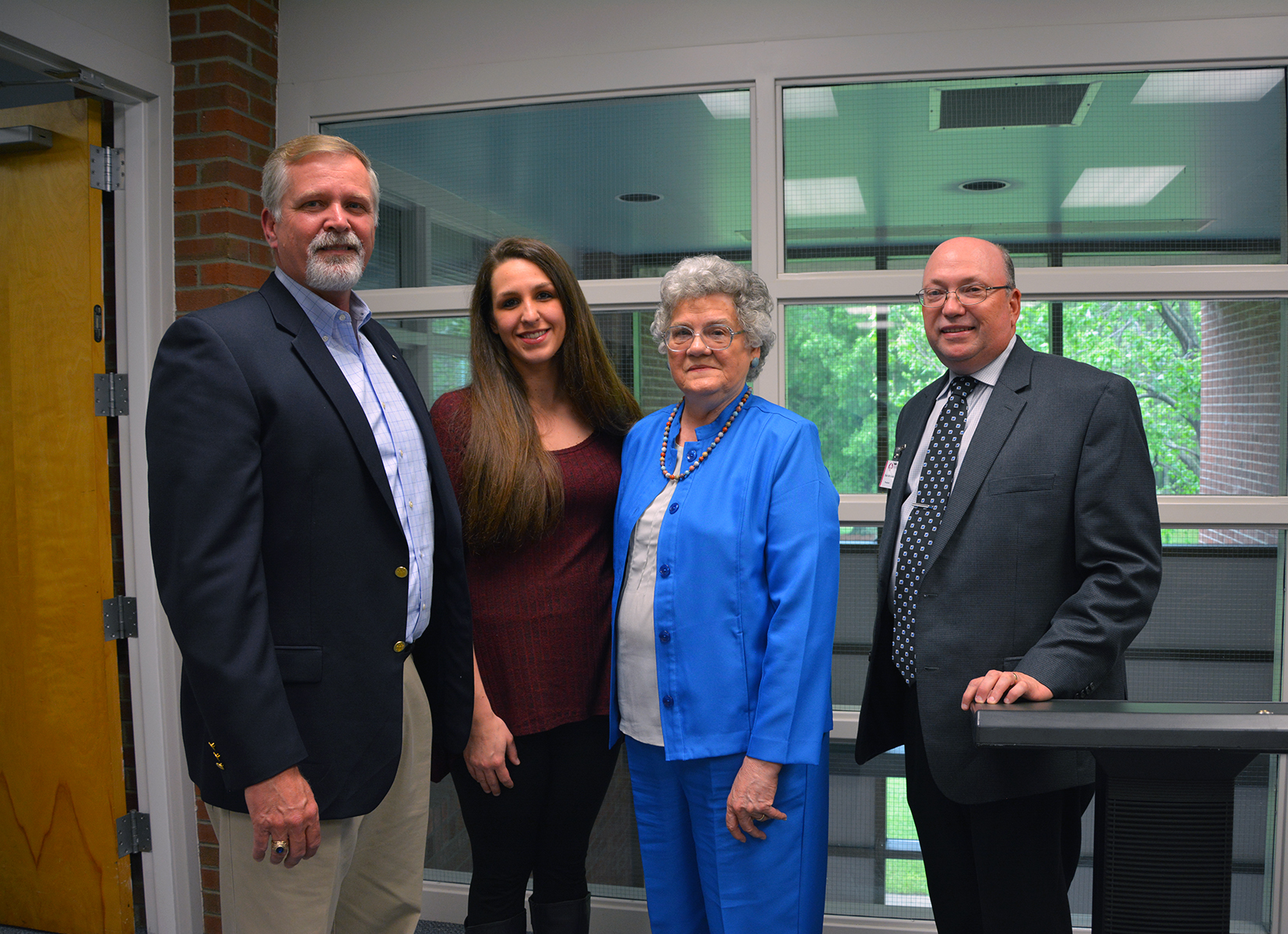 Retired Lt. Col. Ed O’Neal, U.S. Air Force, (left) established the D.R. “Ted” Smith Memorial Scholarship at Richmond Community College. He is pictured with his daughter, Whitney, and Smith’s wife, Peggy, with Dr. Dale McInnis, President of RichmondCC.