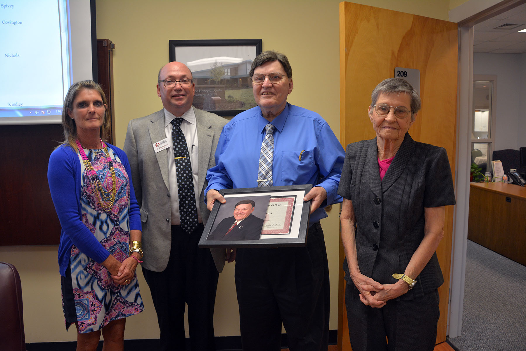 Retiring Richmond Community College Board of Trustee Bert Unger was honored at Tuesday’s board meeting and granted Trustee Emeritus status for his many years of service on the board. Pictured are, from left, Board Chair Claudia Robinette, Dr. Dale McInnis, Unger and Unger’s wife, Barbara.