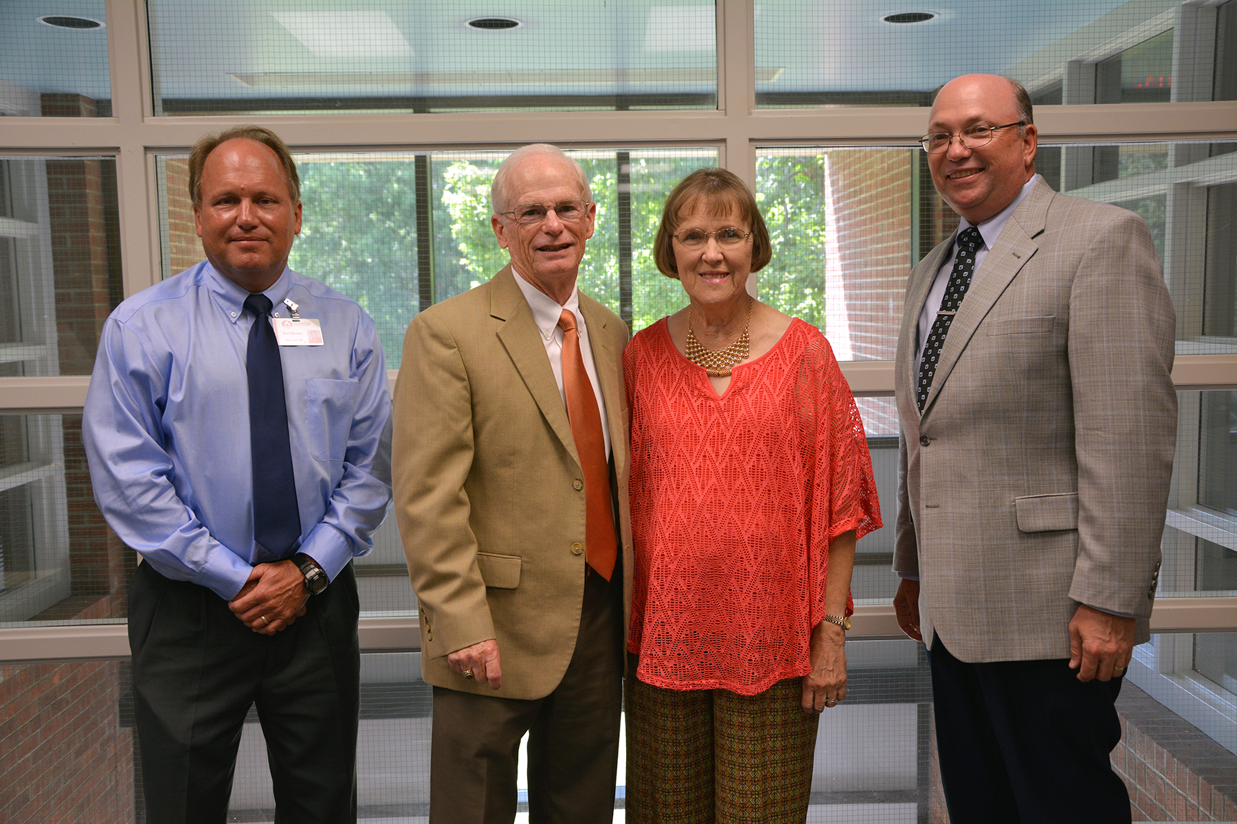 Dr. Hal Shuler, far left, and Dr. Dale McInnis, far right, stand with Bill and Jan Cooke after a reception for the new scholarship they established at Richmond Community College in memory of Bill’s parents.