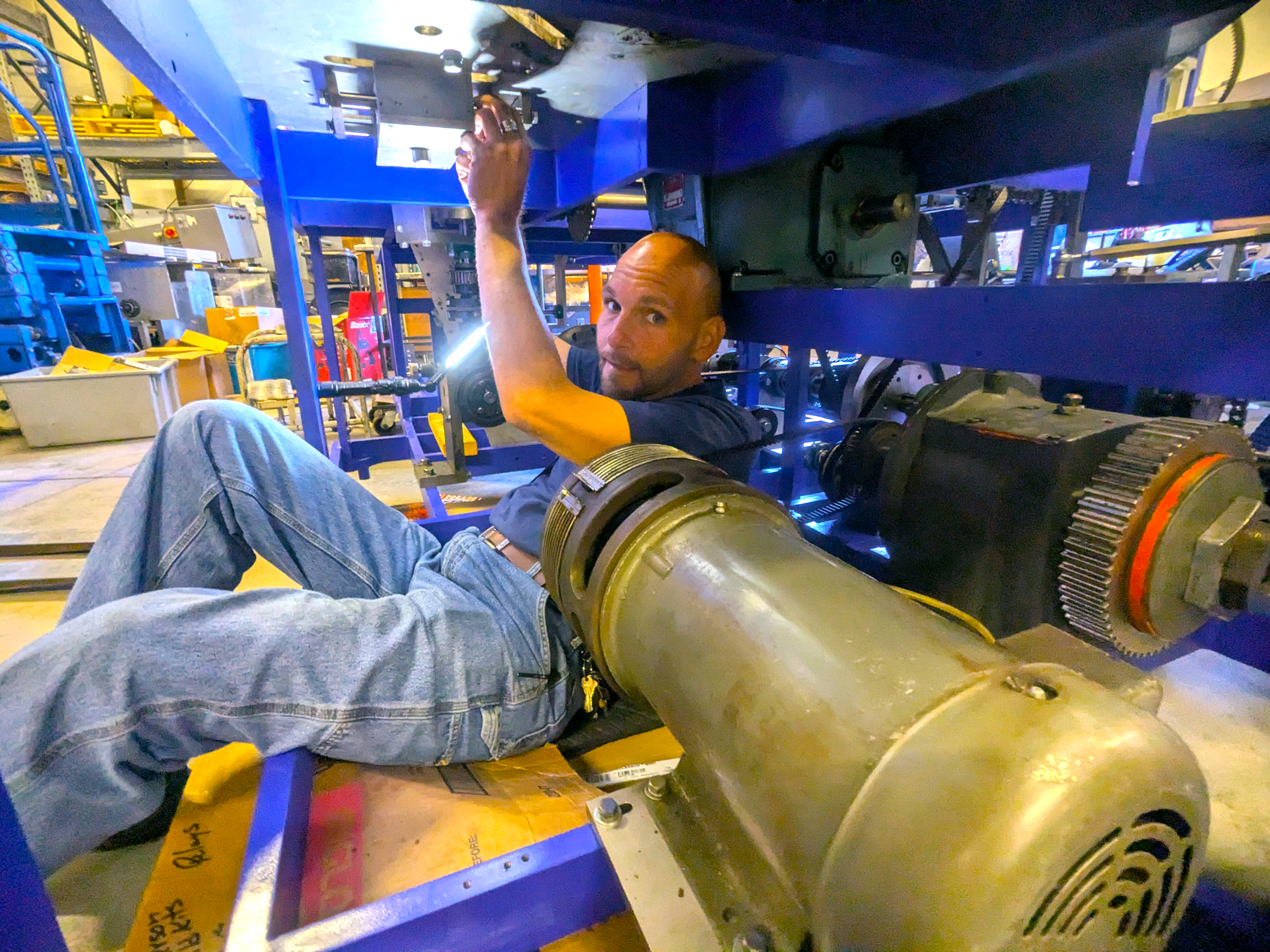 Industrial Systems Intern working on a machine
