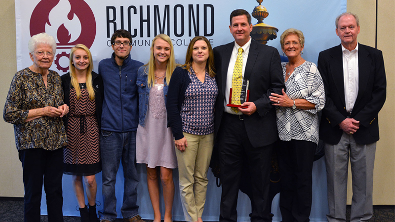 Brett Deaton and Family Pose for Photo at the Cole Auditorium 