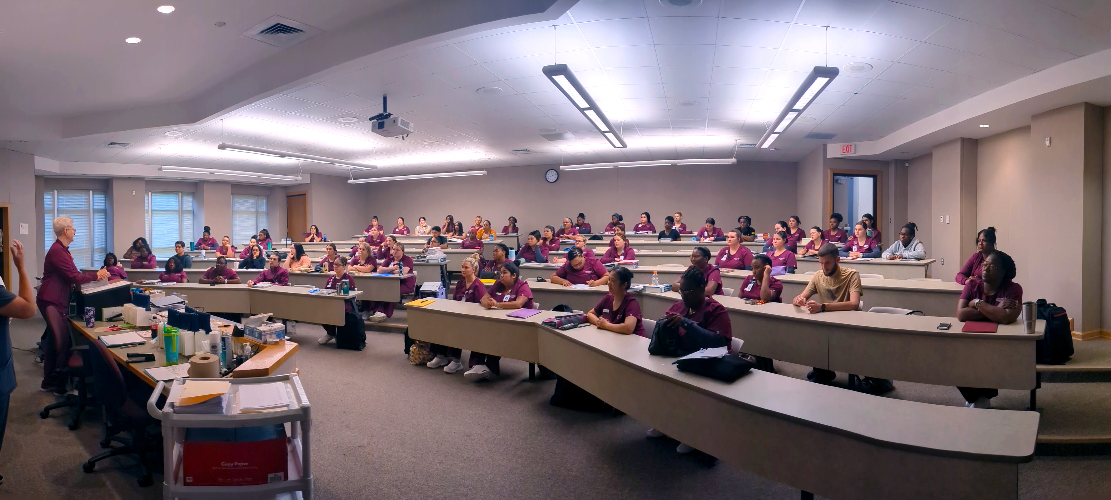 Students in the Grimsley Building sit in a lecture hall