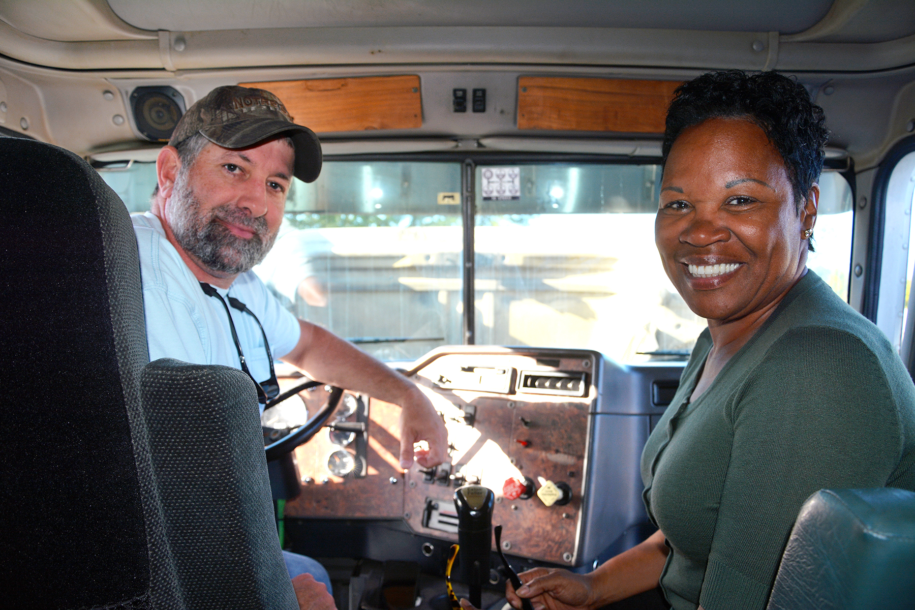 1.	Truck driver training student Cameron Wright sits behind the wheel of an 18-wheeler with Carolyn Everette, who is serving as his interpreter for the duration of the program. Wright is deaf, so Richmond Community College provided him with an interpreter so he could complete the truck driver program.