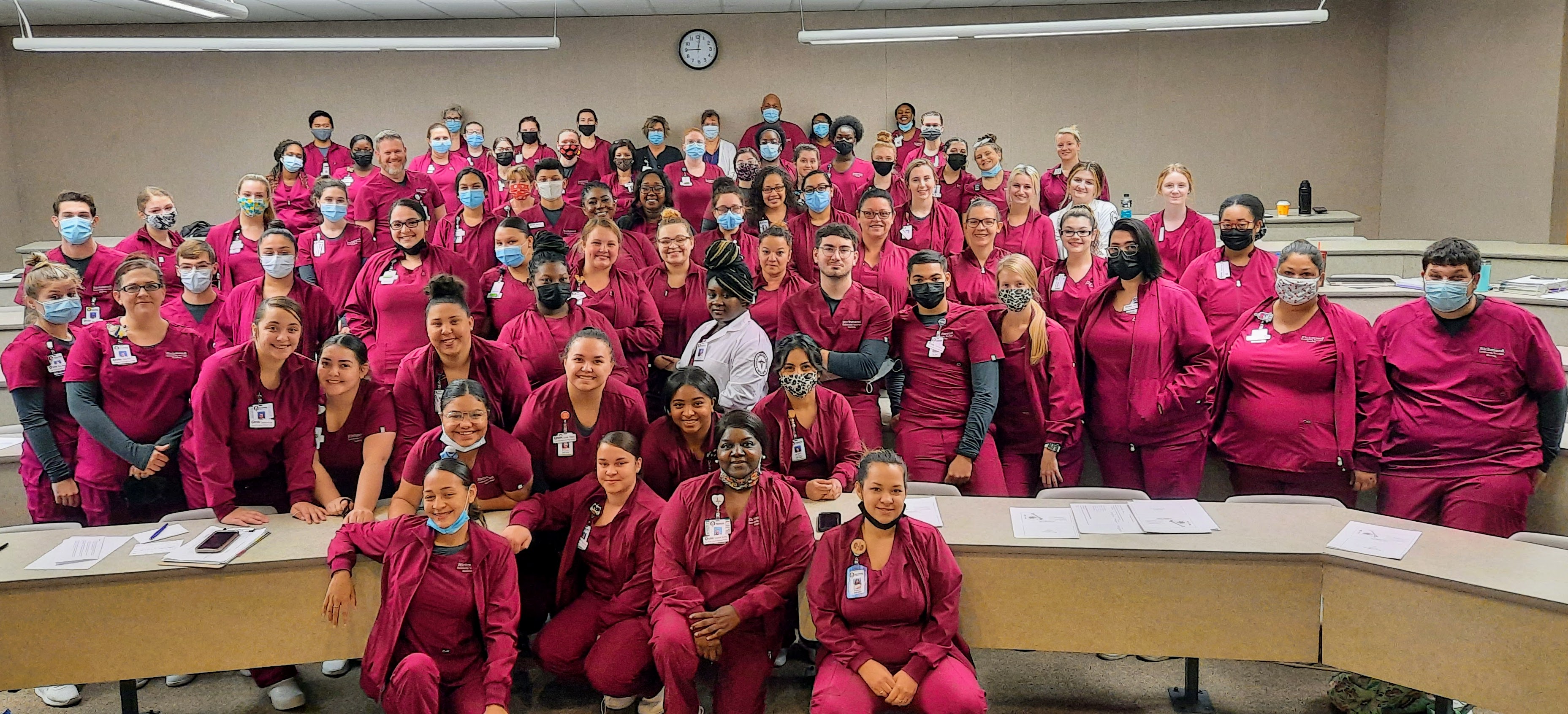 A large group of nursing students pose for photo
