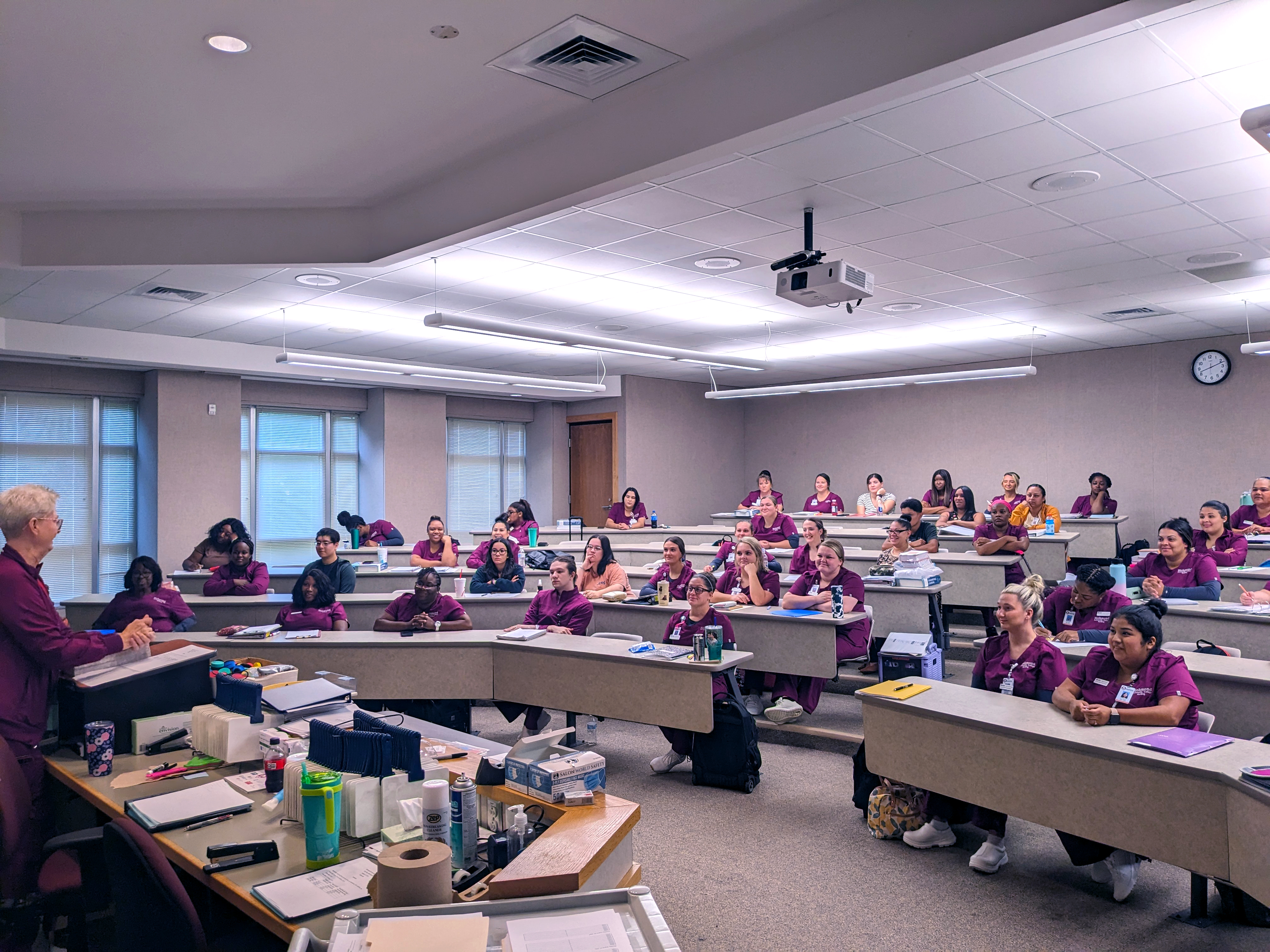 Nursing students sitting in a large classroom