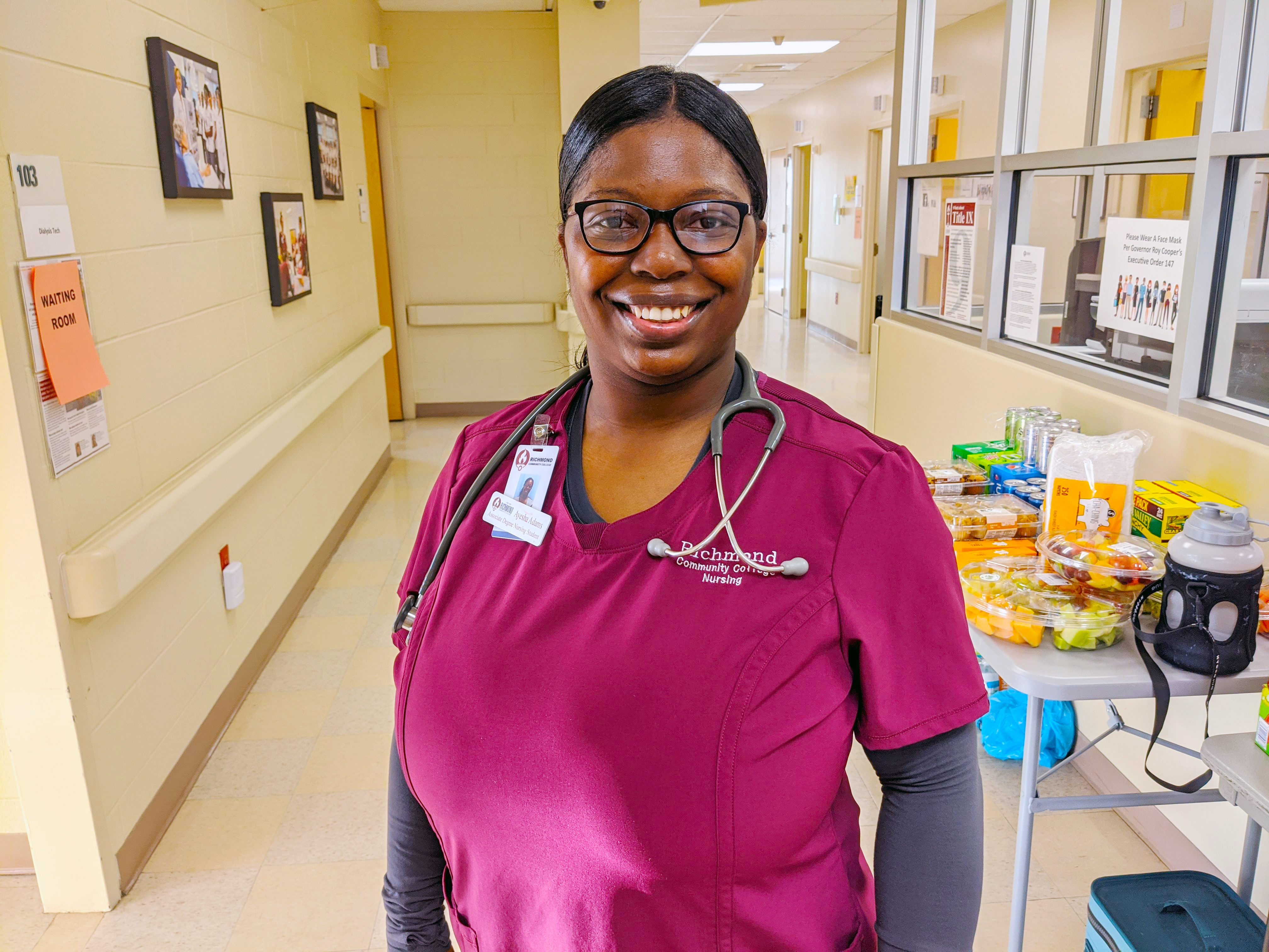 Nursing student Ayesha Adams stands in the hallway of the Simulation Learning Center.