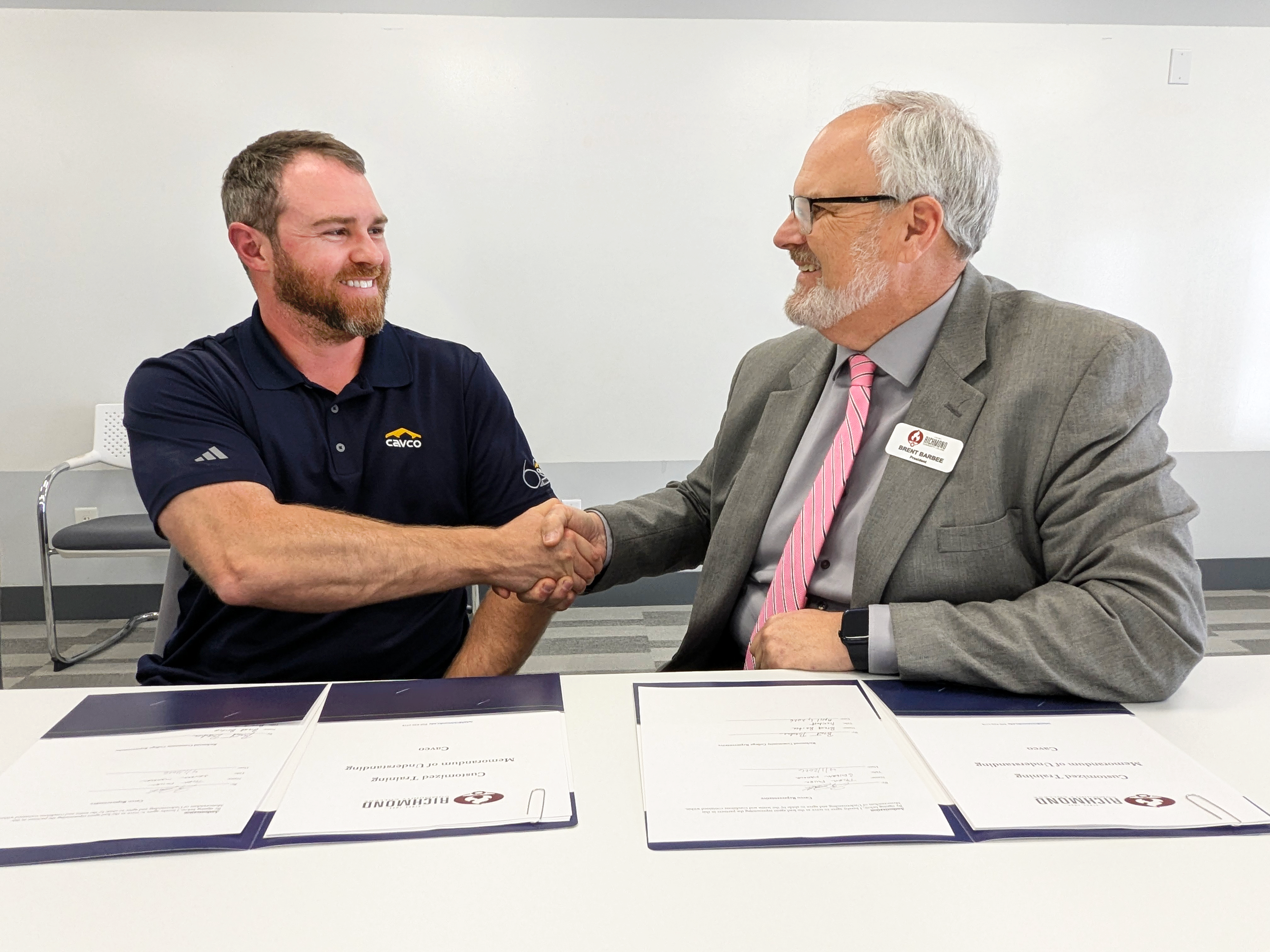 Cavco leader and RichmondCC president shake hands