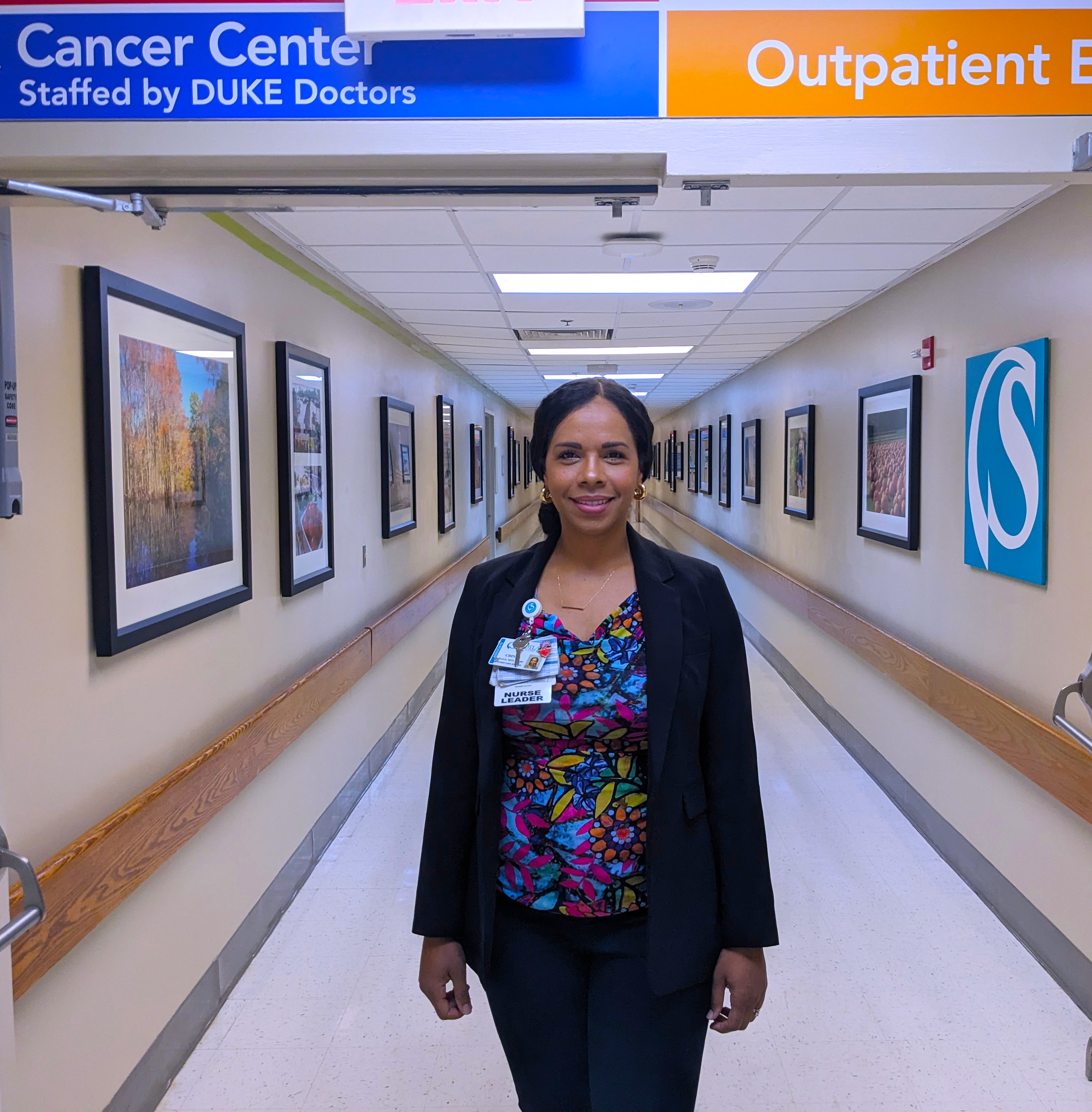 Chinna Hale stands in the hallway of the hospital.