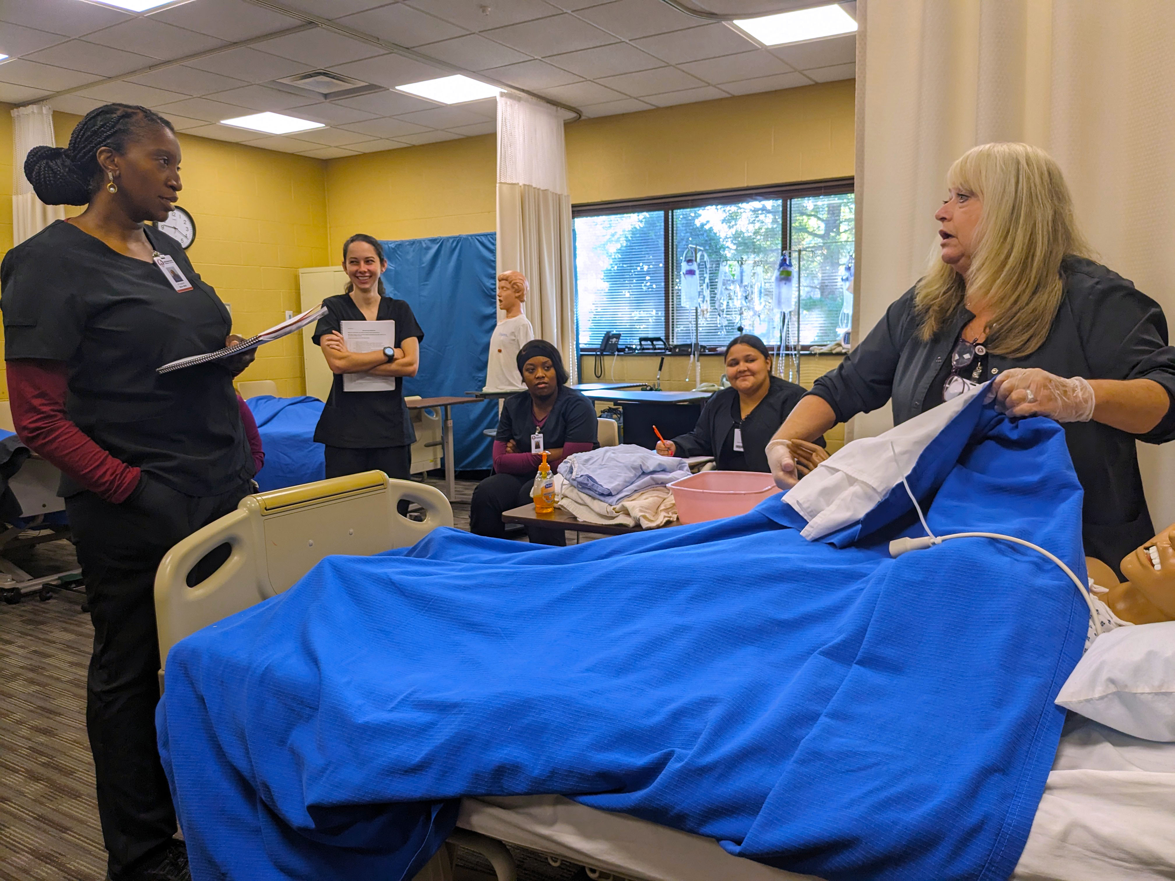 CNA instructor teaches students in class