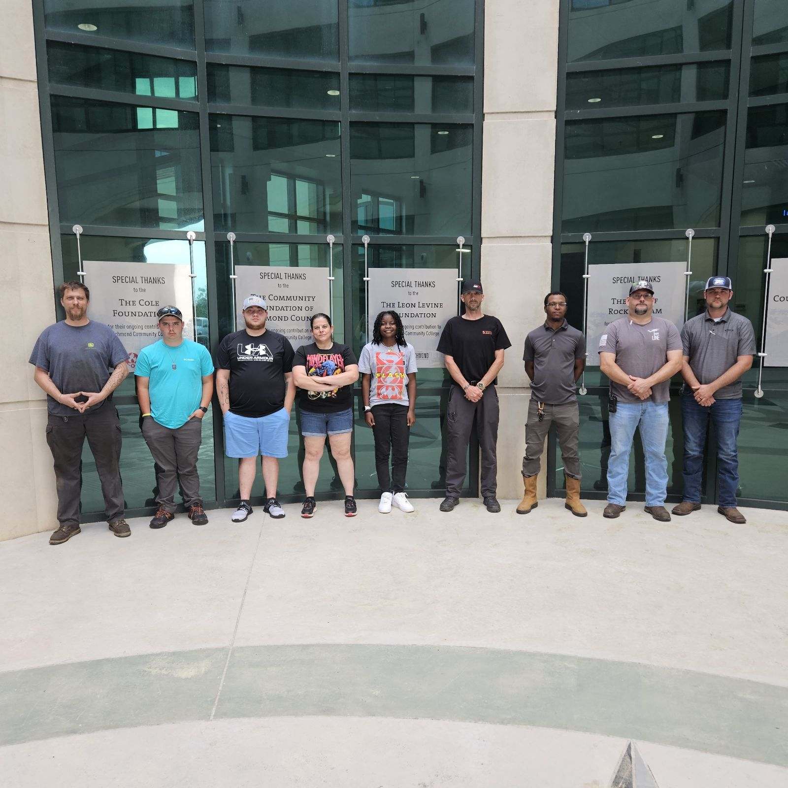 Volunteer firefighters stand in a group for a photo.