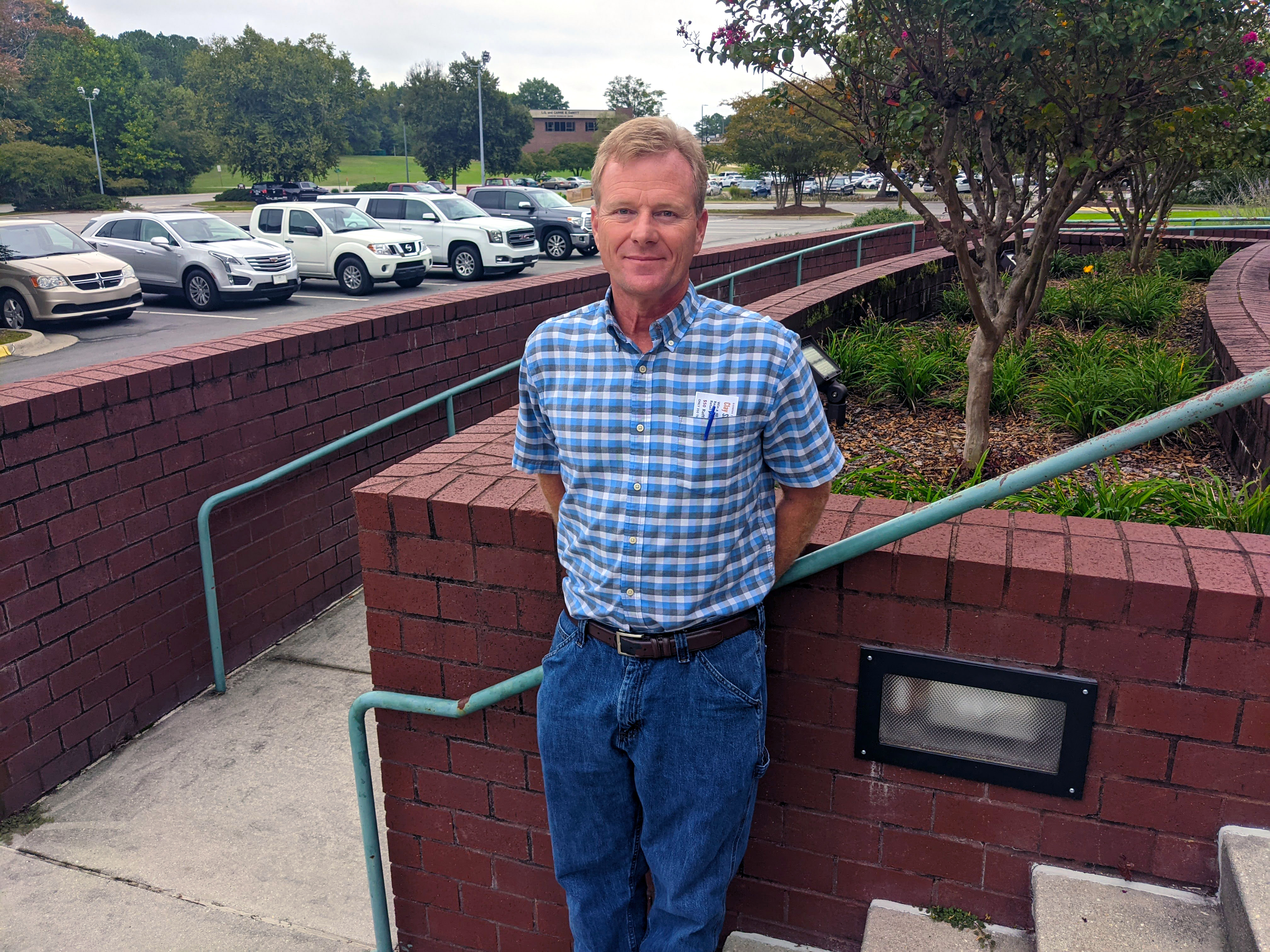 Greg Thompson poses for a photo outside the Cole Auditorium