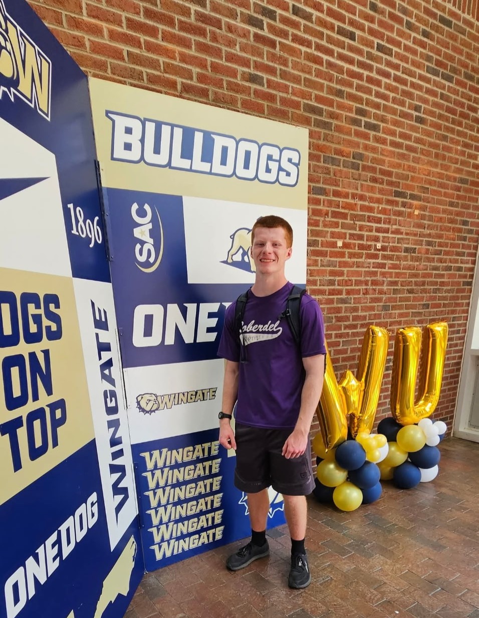 Hudson Hadinger stands by Wingate banner