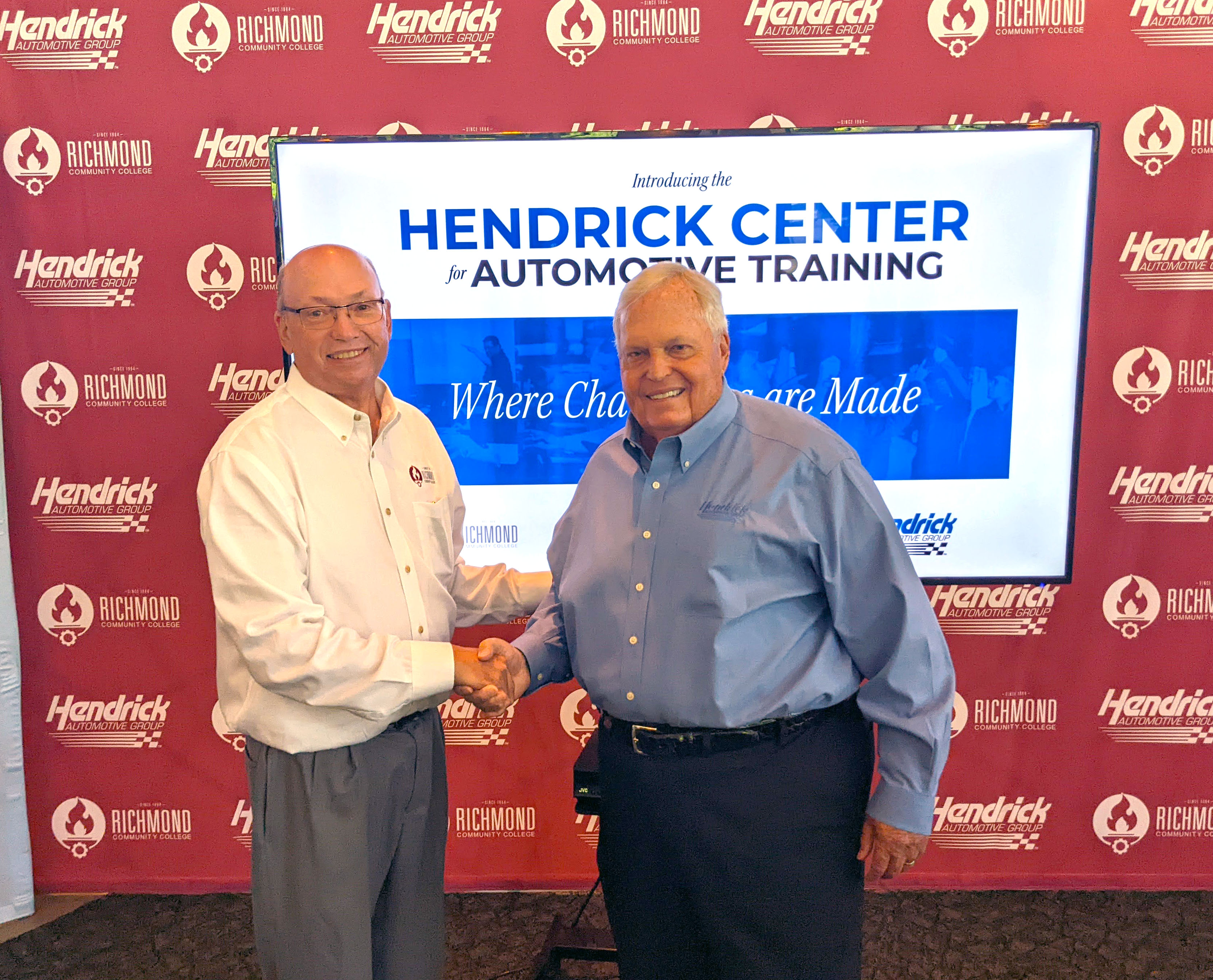 Dr. Dale McInnis and Rick Hendrick shake hands