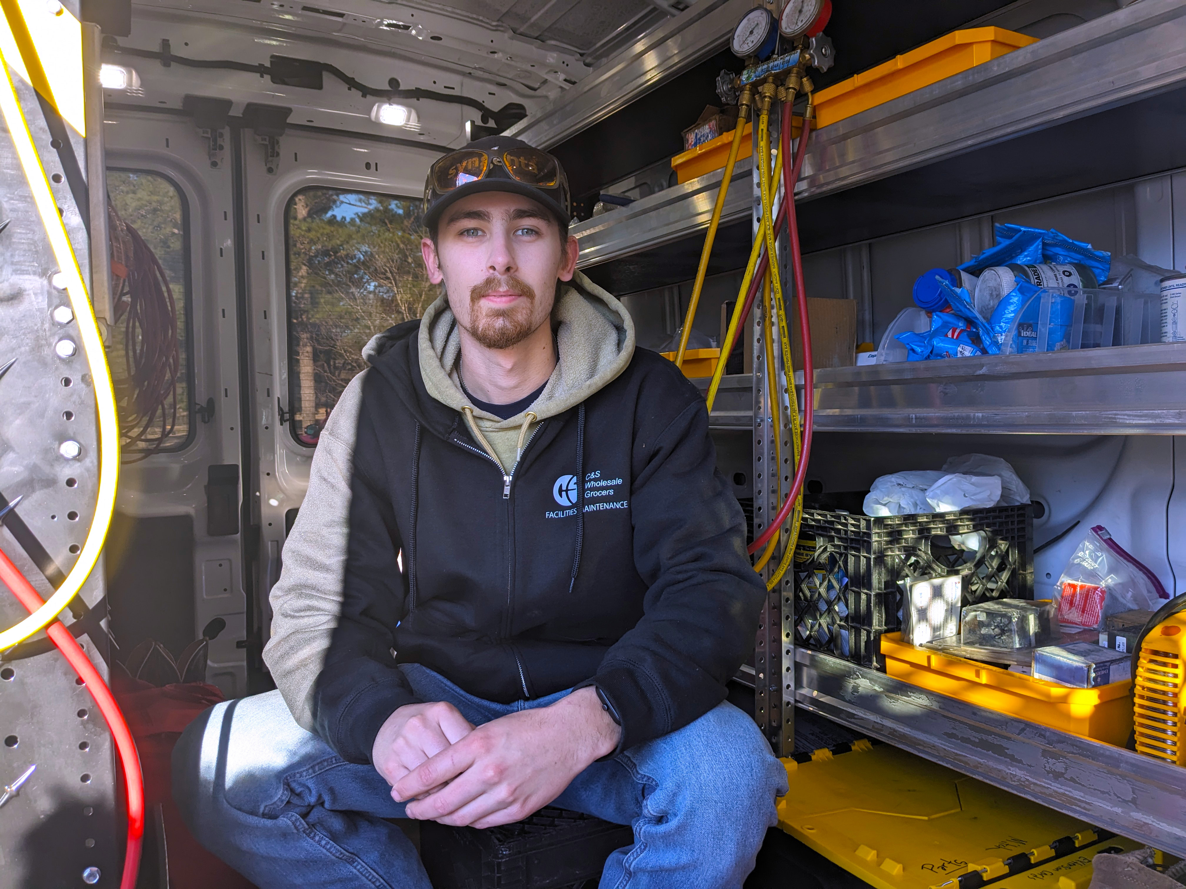 HVAC student Mitchell Paul inside his service van.