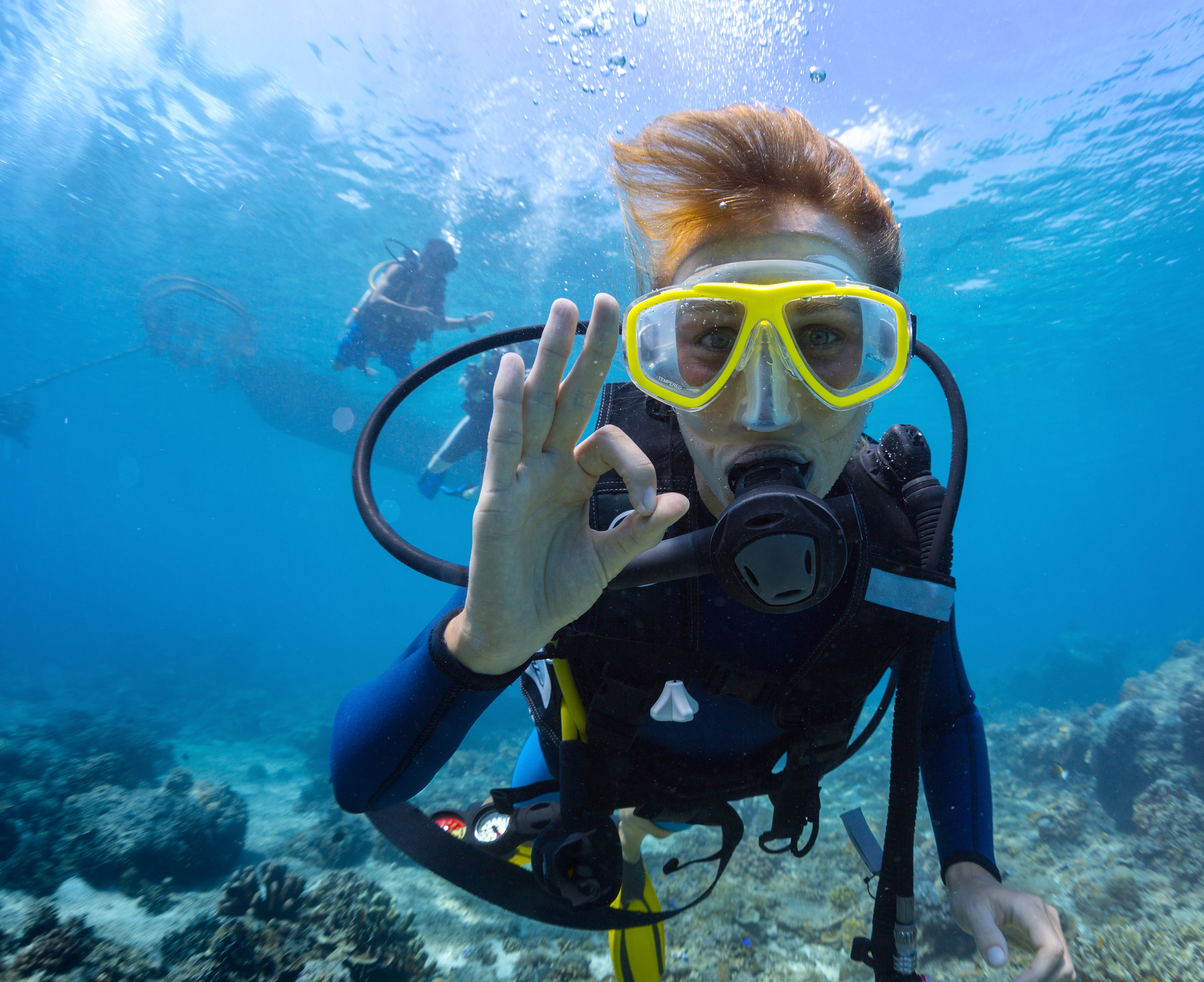 Scuba Diver underwater giving the OK sign