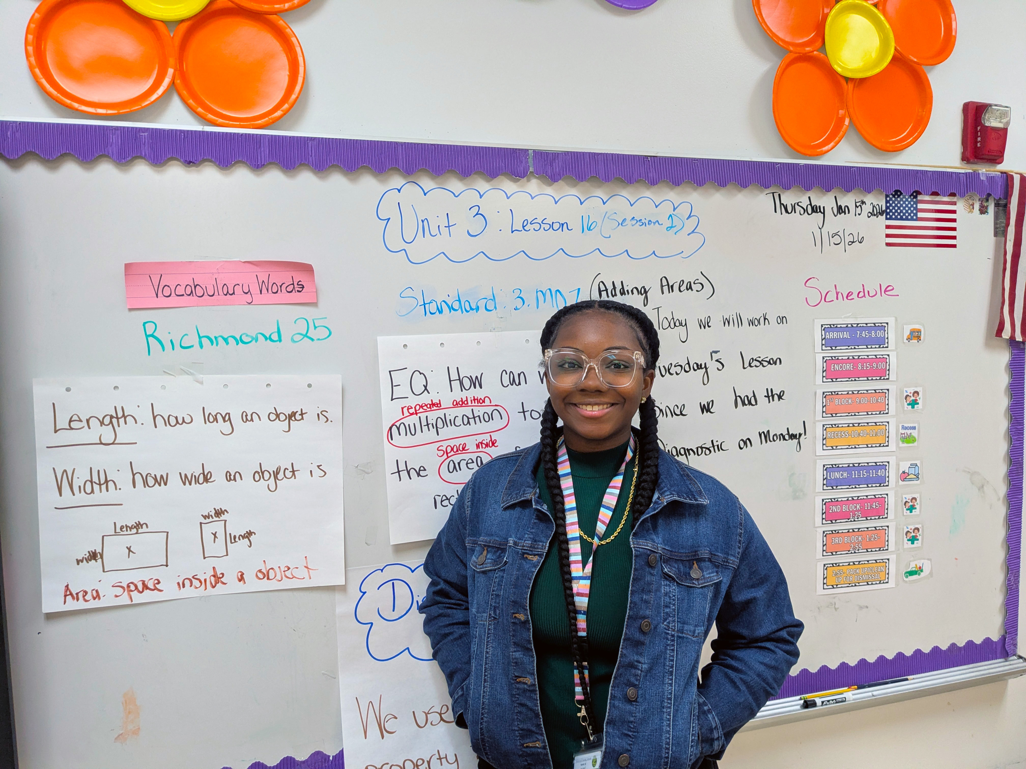Elementary school teacher Jamaya Crump stands in her classroom.