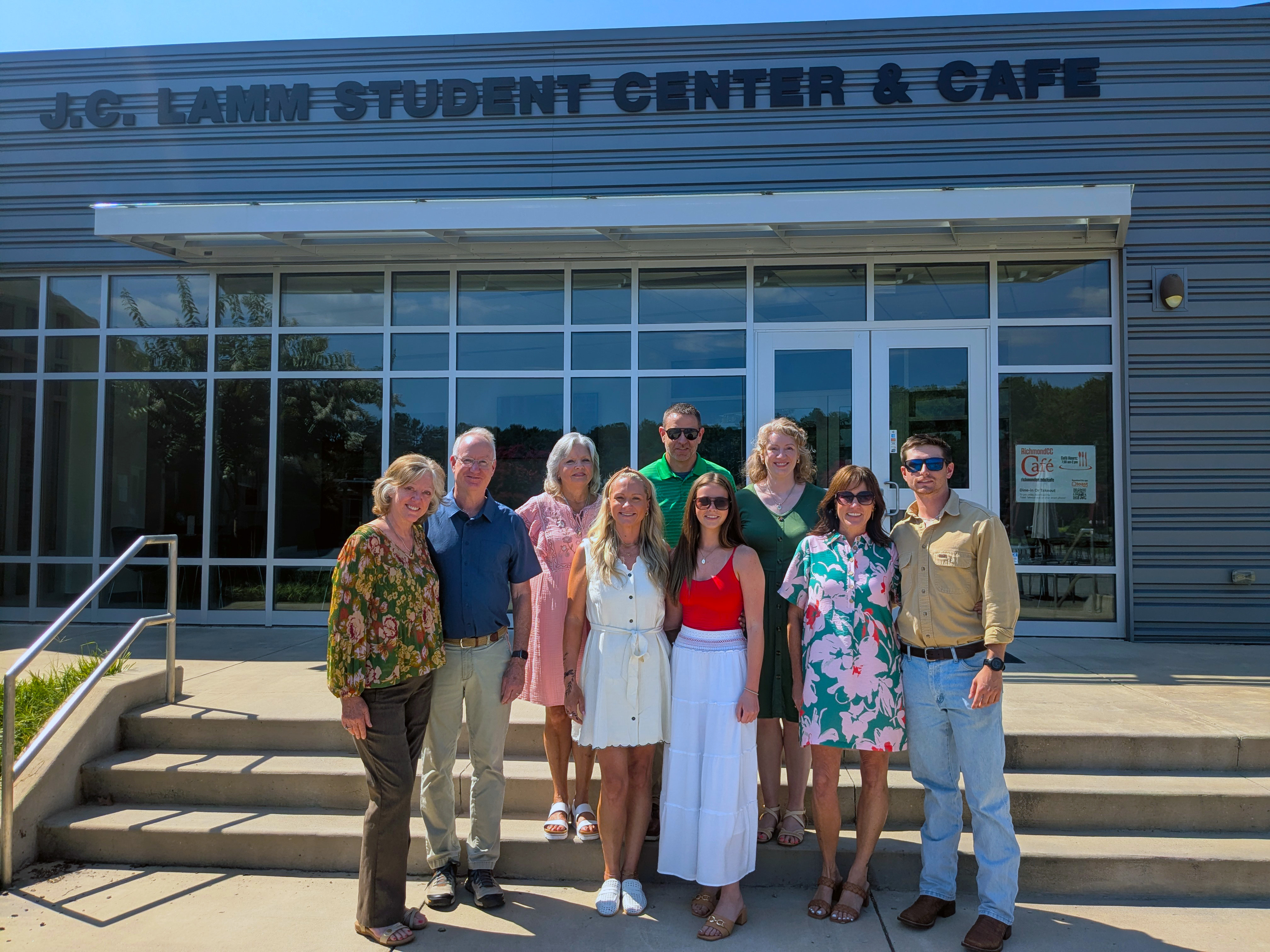 The family of J.C. Lamm stands in front of the student center and cafe.