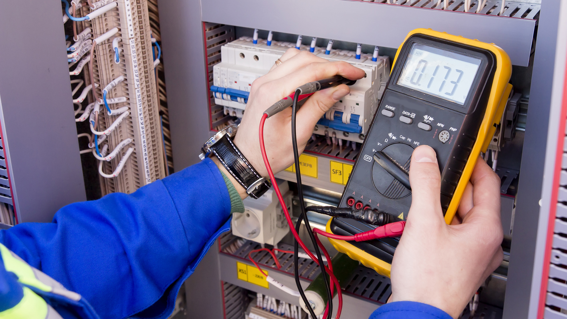 Student uses a multimeter on an electrical device