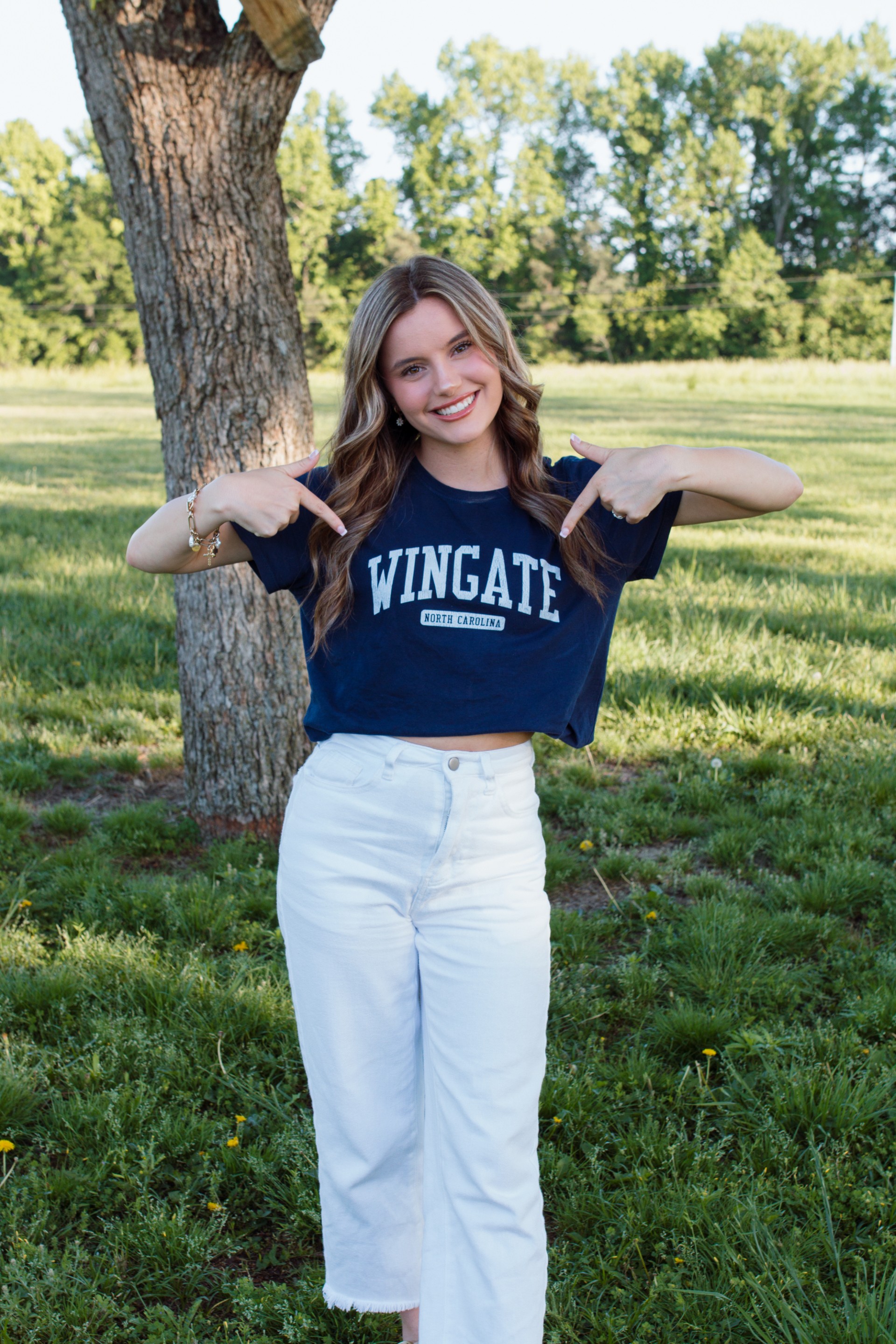 Riley Howell poses wearing a Wingate shirt.