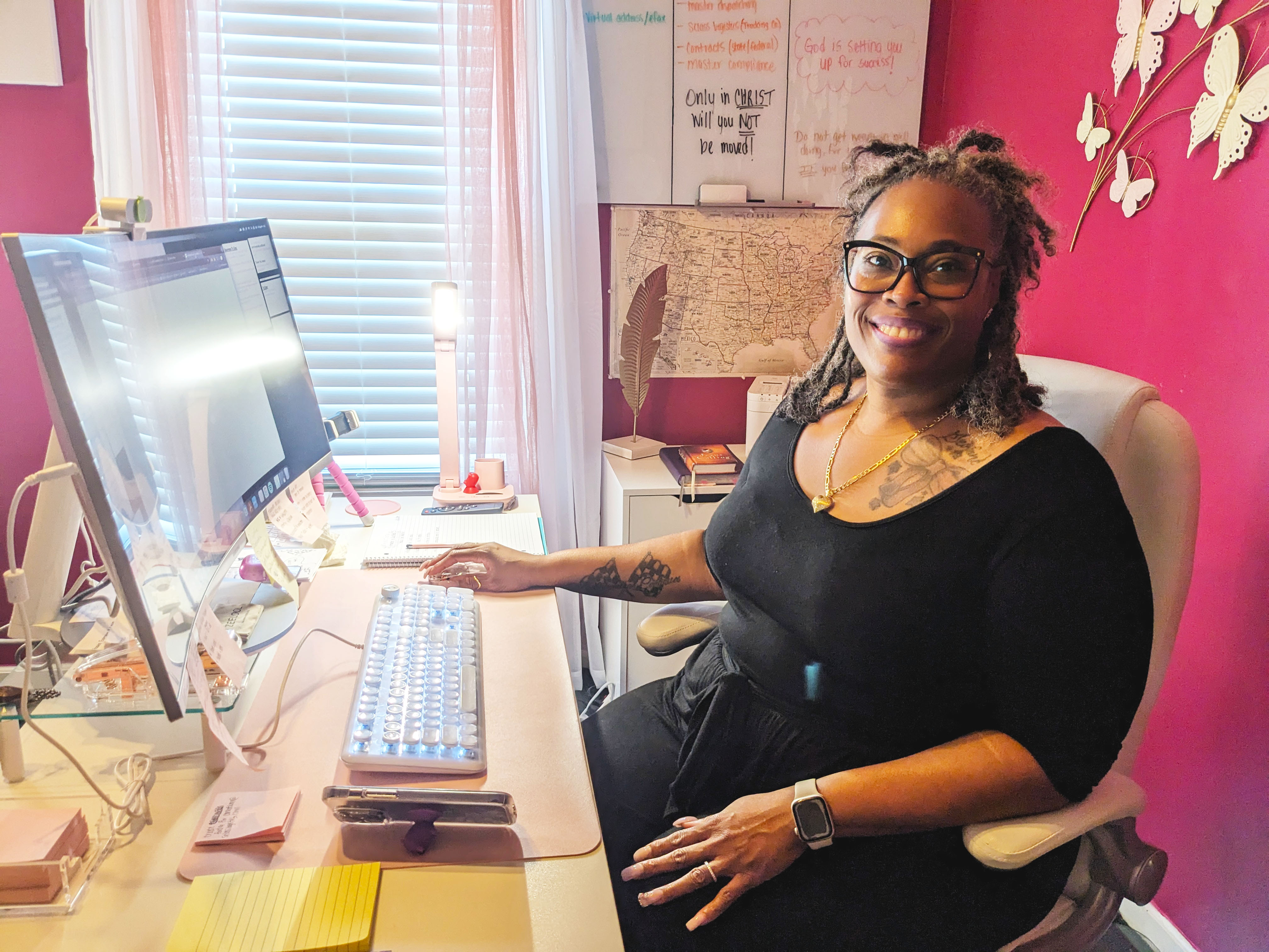 Shanieka Davis sits at her office desk.