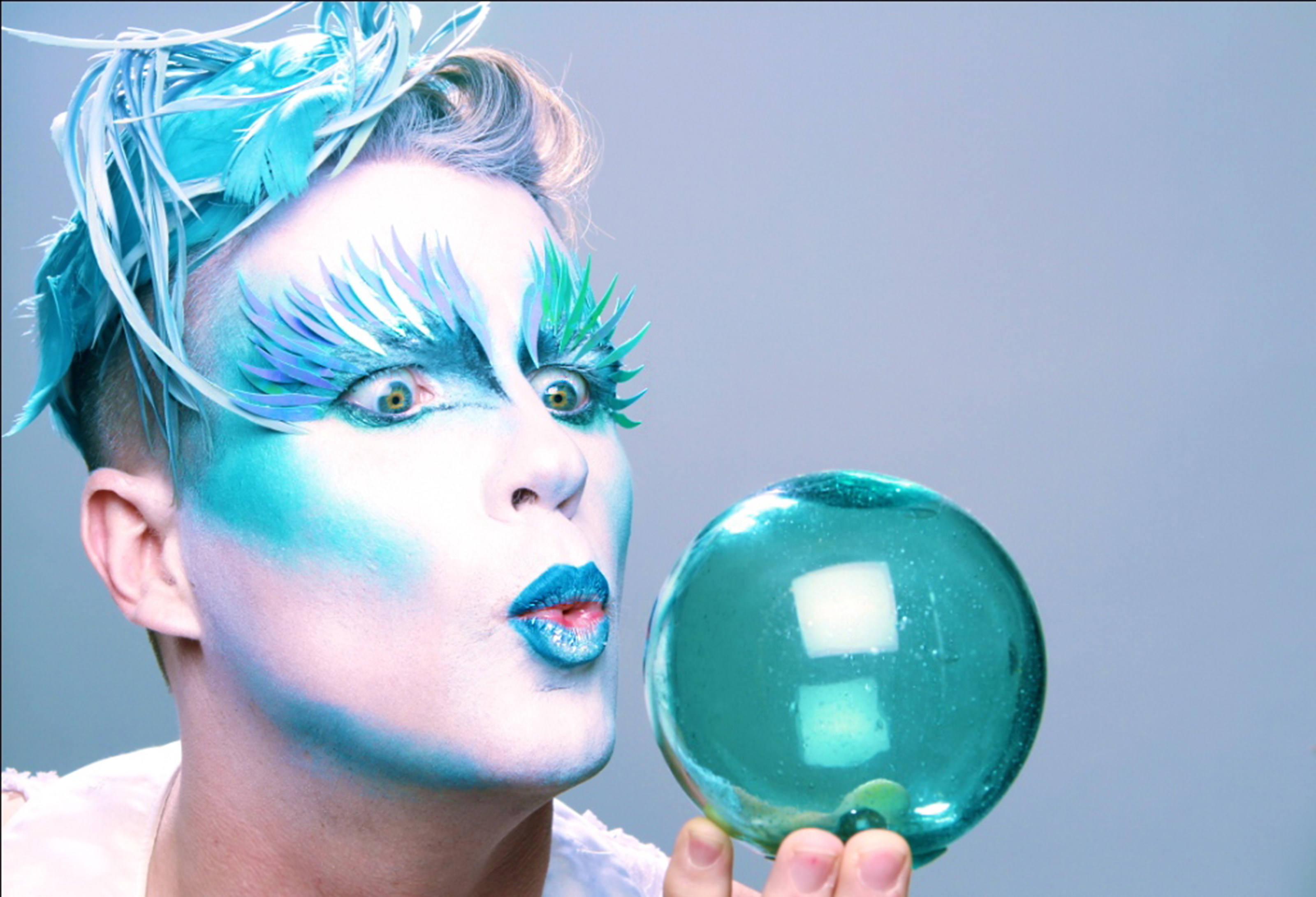 Shimmer performer with a globe