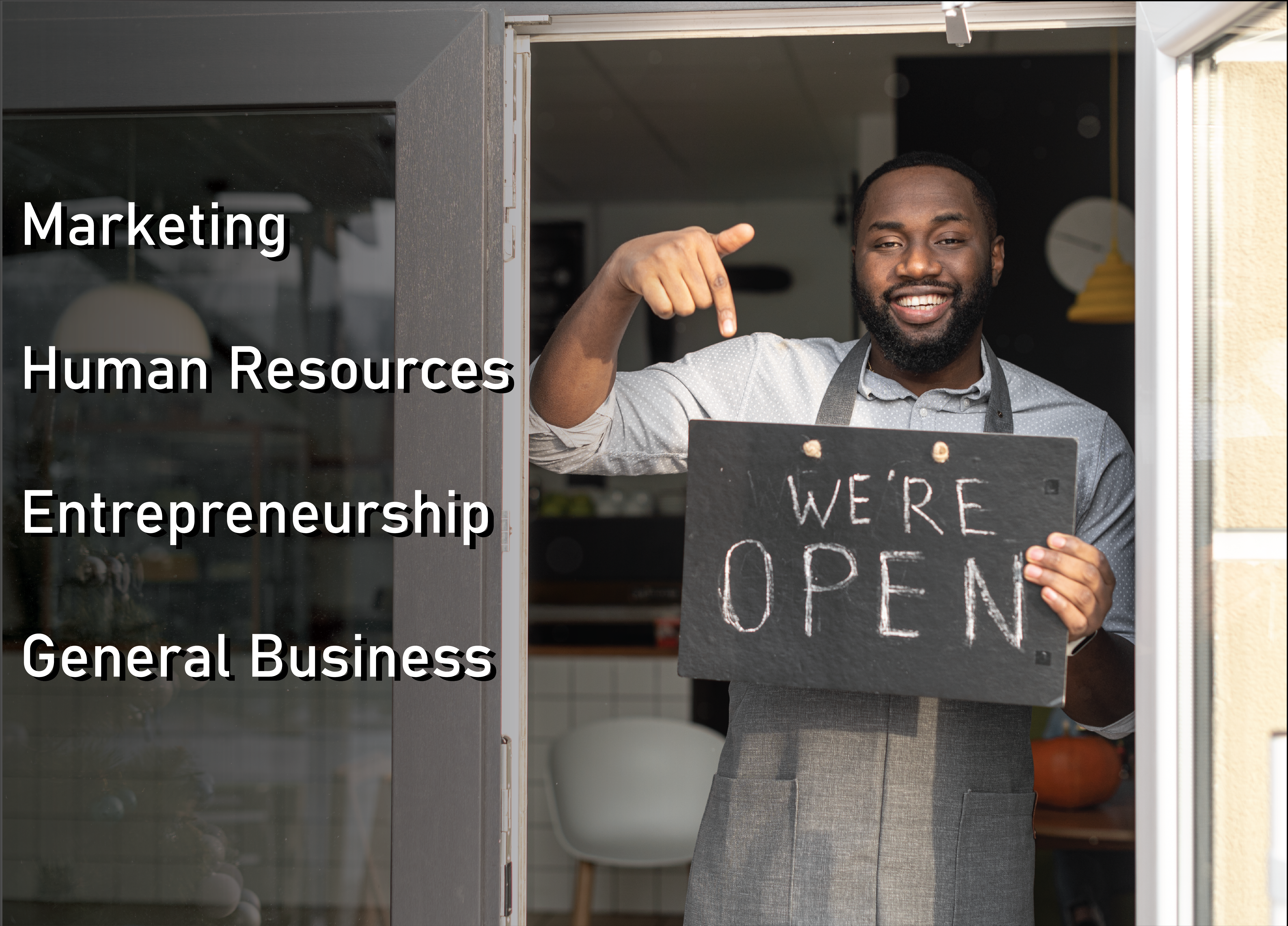 Business owner with a "We're Open" sign. Words added to image are Marketing, Human Resources, Entrepreneurship and General Business