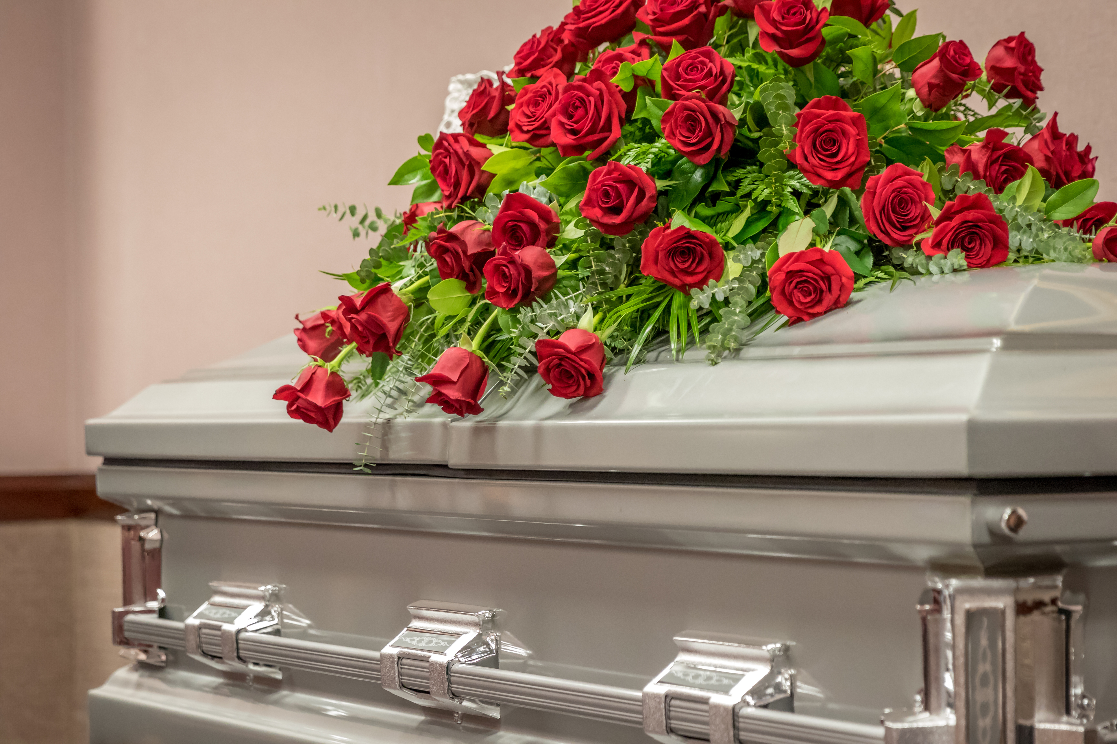image of casket with roses