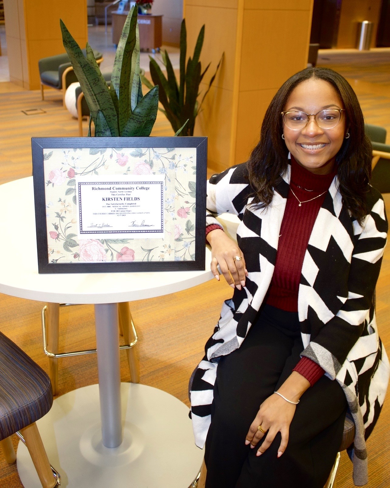 Medical Office Administrative Assistant graduate Kirsten Fields holds her certificate from RichmondCC.