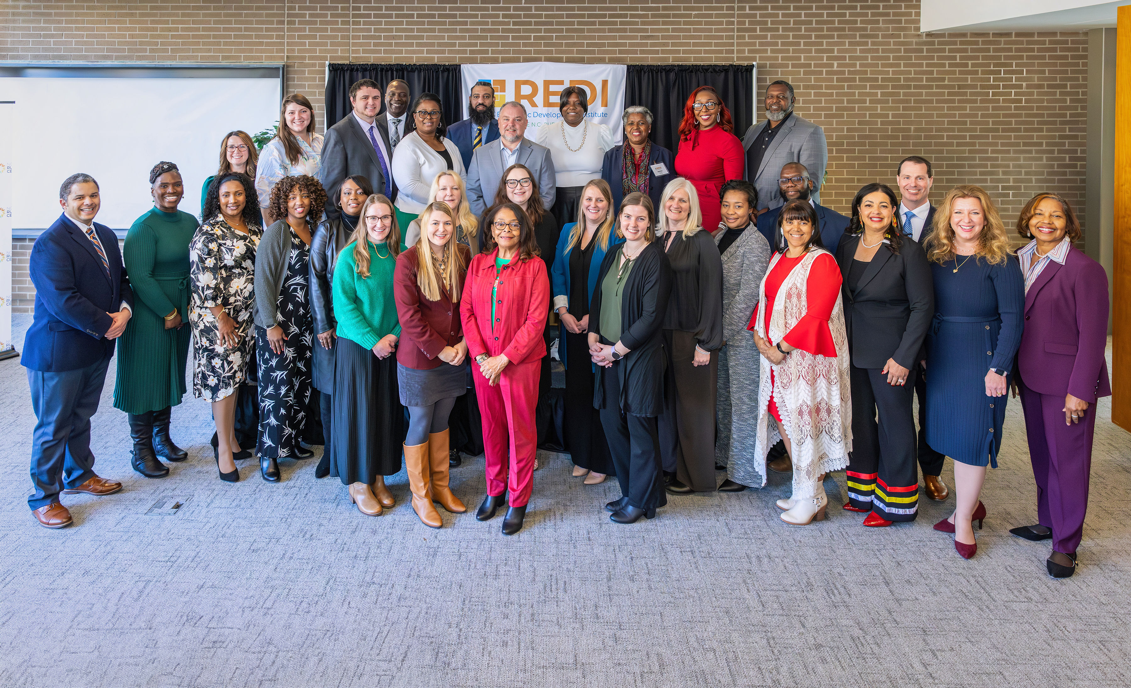 REDI graduates pose for a group photo.