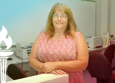 Health Information Technology graduate Ramona Laxton stands in a lab at Richmond Community College